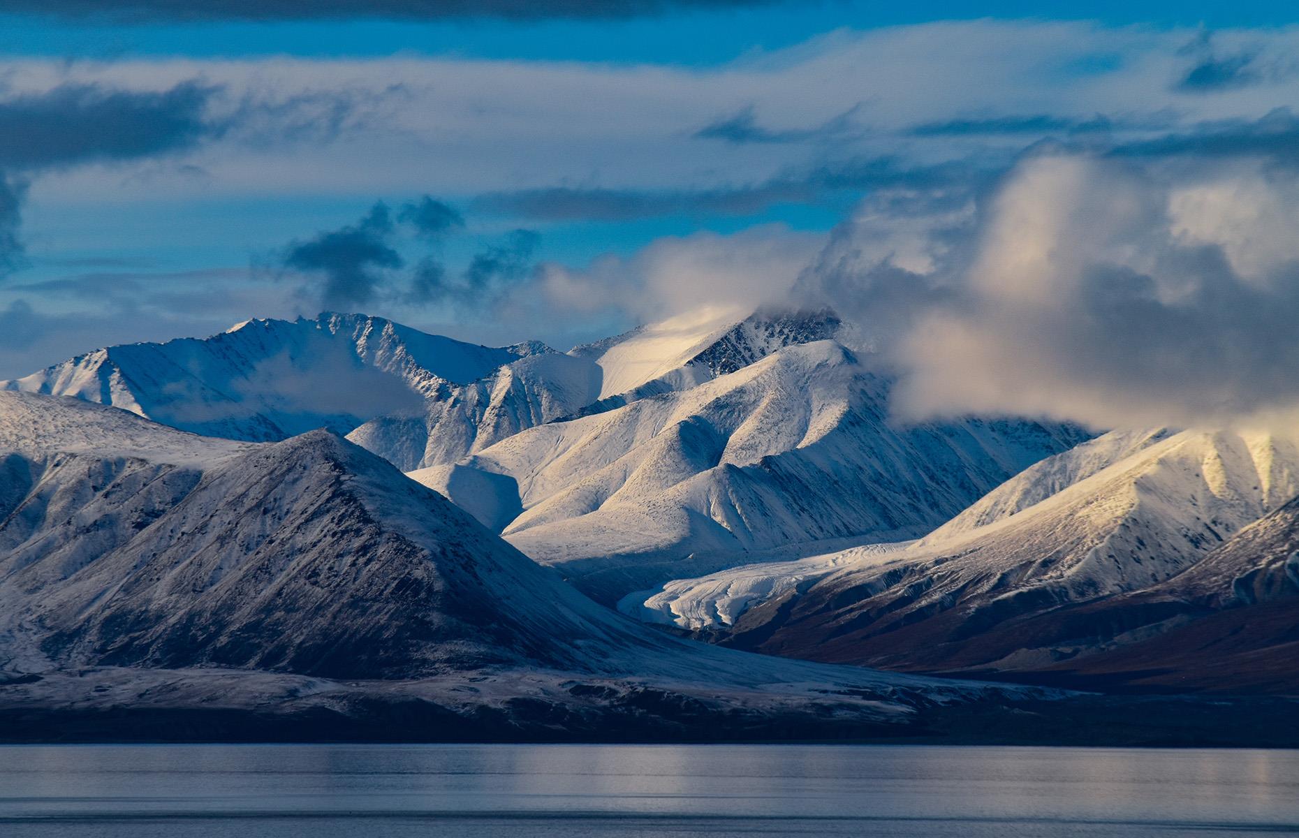 Slide 10 of 44: One of the world's trickiest bodies of water to navigate, the Northwest Passage stretches across the top of Canada, between the North Pole and the far northern reaches of the American continent. The passage was first navigated by explorer Roald Amundsen in the early 20th century.