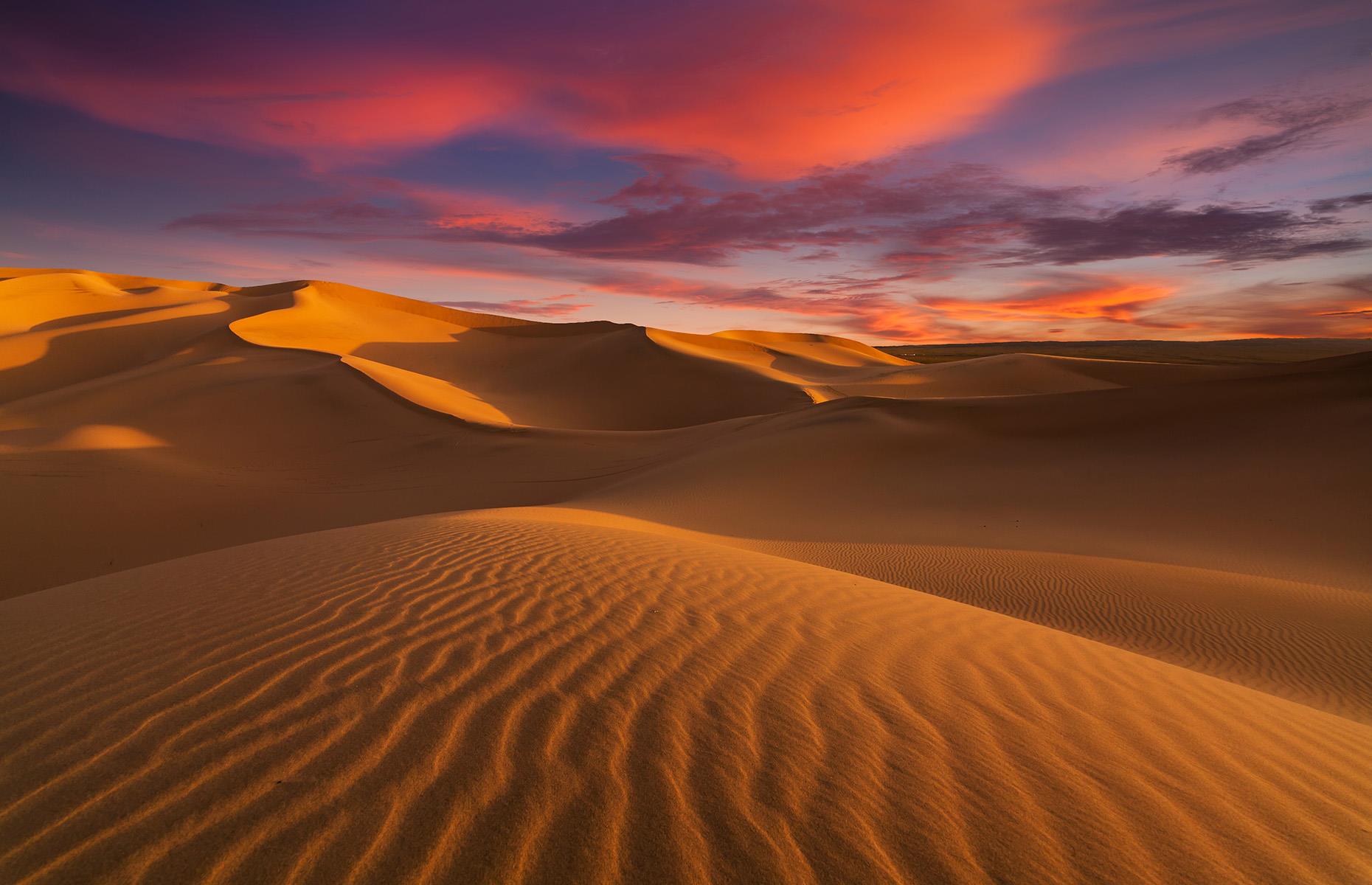 Slide 21 of 44: The world's largest hot desert, the Sahara stretches across much of northern Africa. Entire cities are located within the yellow sands of this barren landscape, but beyond them there are entire swathes of the region that are yet to be explored.