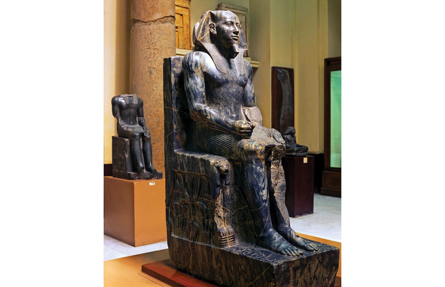 Slide 5 of 14: The Great Sphinx is joined by the Sphinx Temple and the Valley Temple, which once contained multiple fine statues of King Khaefre – one of these statues is pictured here. It's regarded as a supreme example of artistic skill in representing the king as both all-powerful and divine: the high degree of polishing across all the surfaces would have reflected the available light, and the green veins within the diorite stone would have enhanced the unworldly effect. It can now be seen in the Egyptian Museum in Cairo.