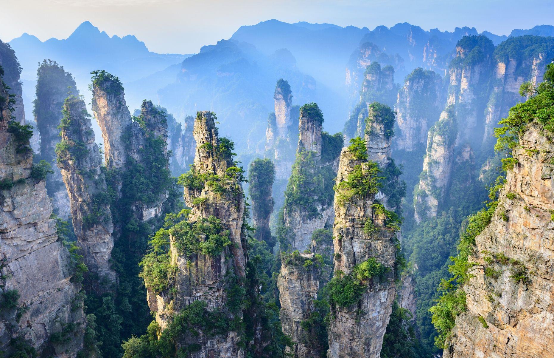 Slide 59 of 59: The strange and unique landscape of Zhangjiajie National Forest Park features marvelous sandstone pillars, towering up from a seemingly endless gorge. Located in Hunan, China, this bizarre but beautiful topography looks otherworldly. In fact, so fantastical is this dream-like place, that James Cameron used it as inspiration for his sci-fi hit Avatar.