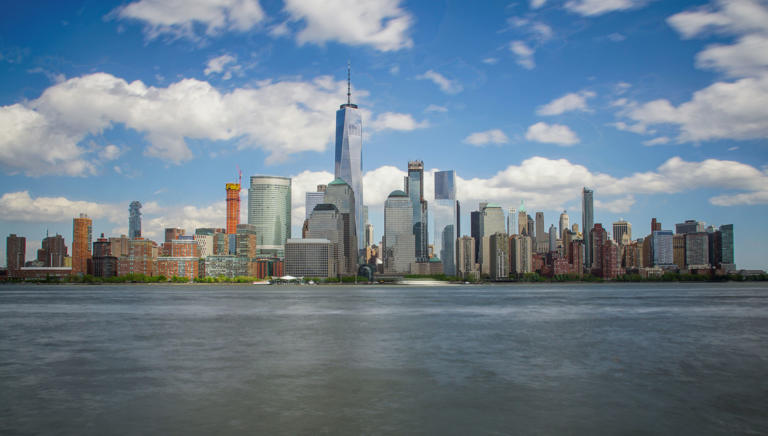 The lower Manhattan skyline of New York City (NYC) including the famous Freedom Tower as seen from Jersey City, New Jersey.