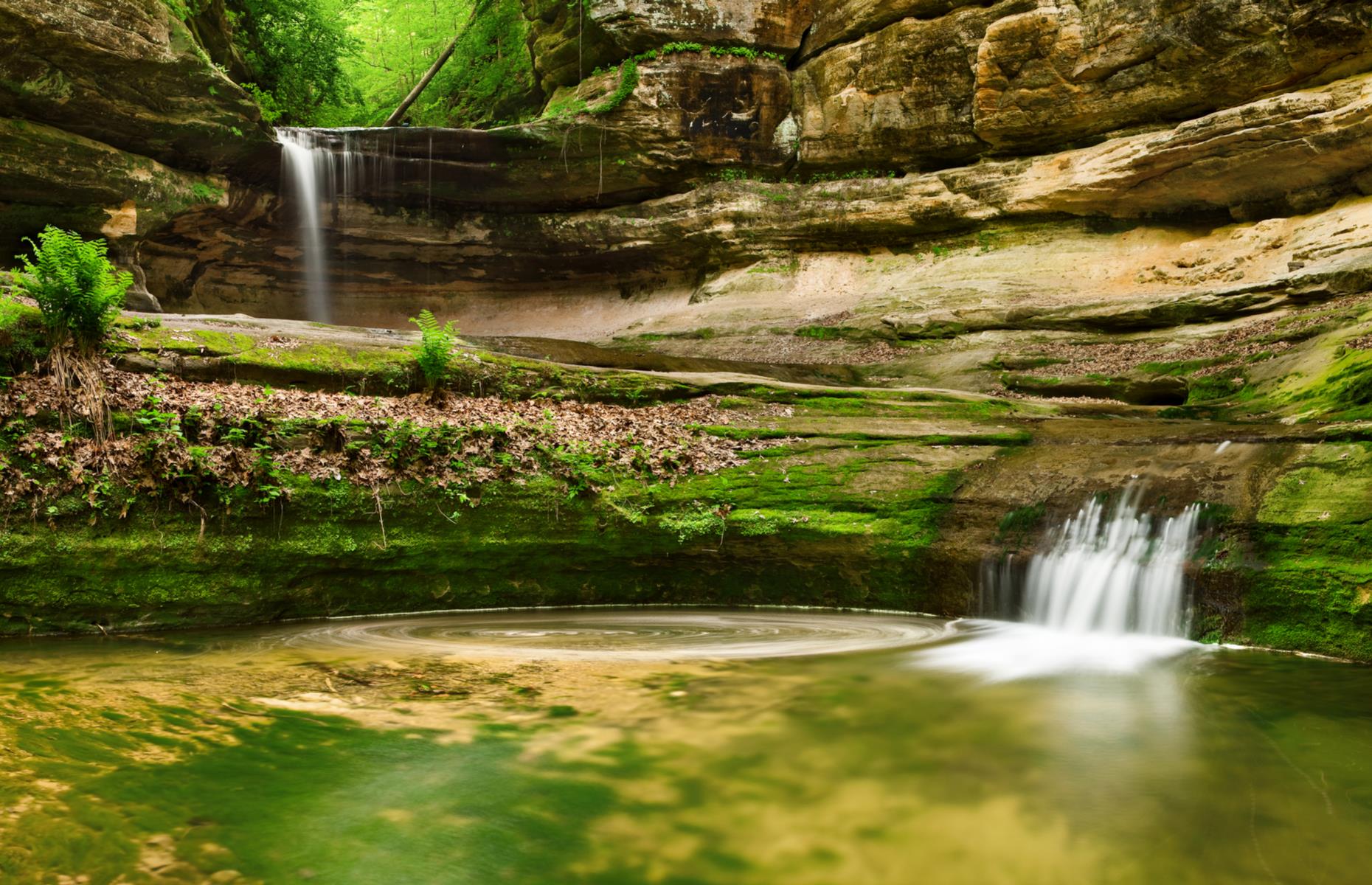 <p>It’s only a two-hour drive from Chicago to Starved Rock State Park but it instantly feels like a different world – sandstone canyons, bald eagles soaring over the Illinois River and waterfalls that freeze mid-flow in winter. There’s just <a href="https://www.starvedrocklodge.com/starved-rock-state-park/">one campground</a> and it fills fast on summer weekends but during the week it’s much easier to get a spot and, usually, it's blissfully quiet. These are <a href="https://www.loveexploring.com/galleries/95339/these-are-americas-most-unspoiled-places">America's most unspoiled places</a>.</p>
