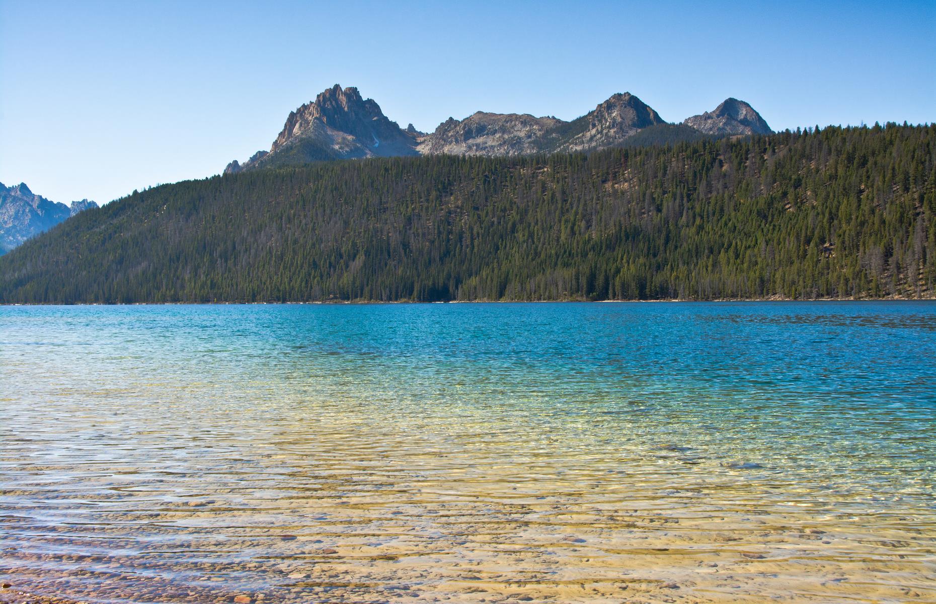 <p>Staying overnight on the shore of <a href="https://www.fs.usda.gov/recarea/sawtooth/recreation/camping-cabins/recarea/?recid=5919&actid=31">Redfish Lake</a>, in Idaho’s Sawtooth National Forest, is pretty much as good as it gets. The RV sites here are steps from the water, which stretches out from a smooth pebble beach. It’s perfect for paddling, swimming and kayaking, with the peaks of the Sawtooth Mountains peeping behind thick pine forest.</p>