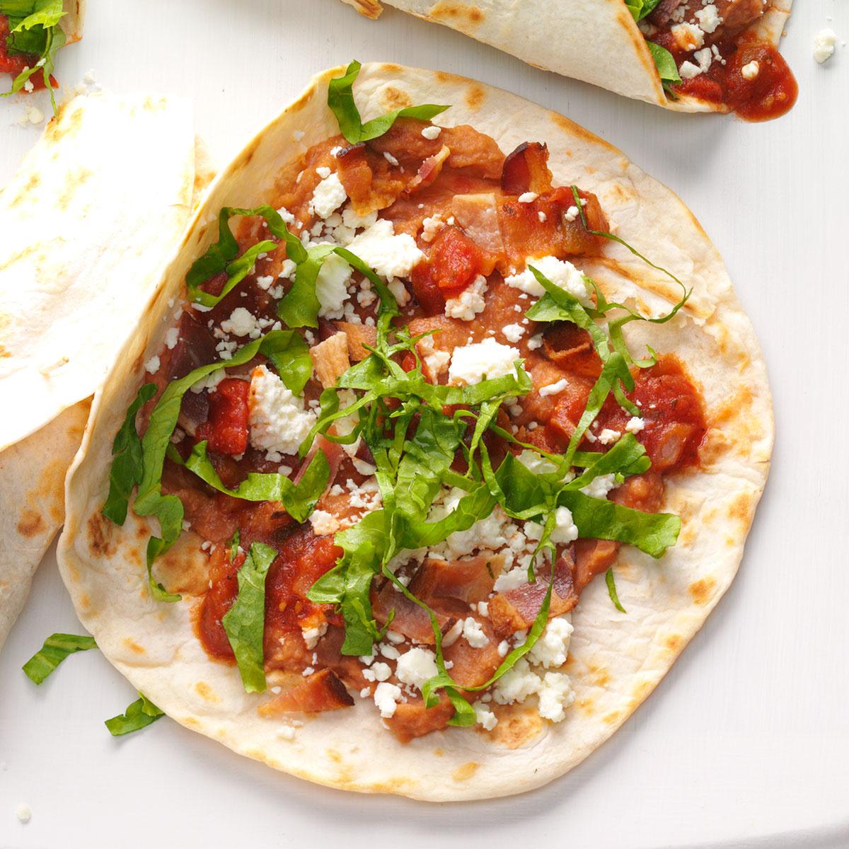 These griddle burritos with bacon and veggies make an awesome hand-held meal. I use fresh pico de gallo when I can, but a jar of salsa works if that’s what you’ve got. —Stacy Mullens, Gresham, Oregon <a href="https://www.tasteofhome.com/recipes/bean-bacon-griddle-burritos/">Get Recipe</a>
