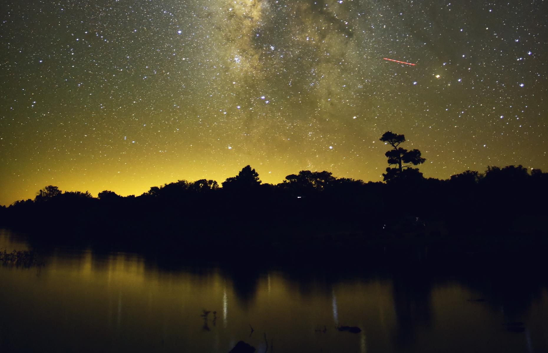 <p>Stargazing’s biggest enemy? Light pollution from nearby electricity-guzzling settlements. Flagstaff, then, is a bit of an anomaly. This city of around 74,000 has worked hard to keep its skies dark and the local Lowell Observatory (<a href="https://lowell.edu/">temporarily closed</a>) even discovered Pluto in 1930. Visitors can see constellations from their doorstep or window ledge and, around 20 miles (32km) southeast of Flagstaff, Ashurst Lake reflects glittering skies on its glassy surface. </p>