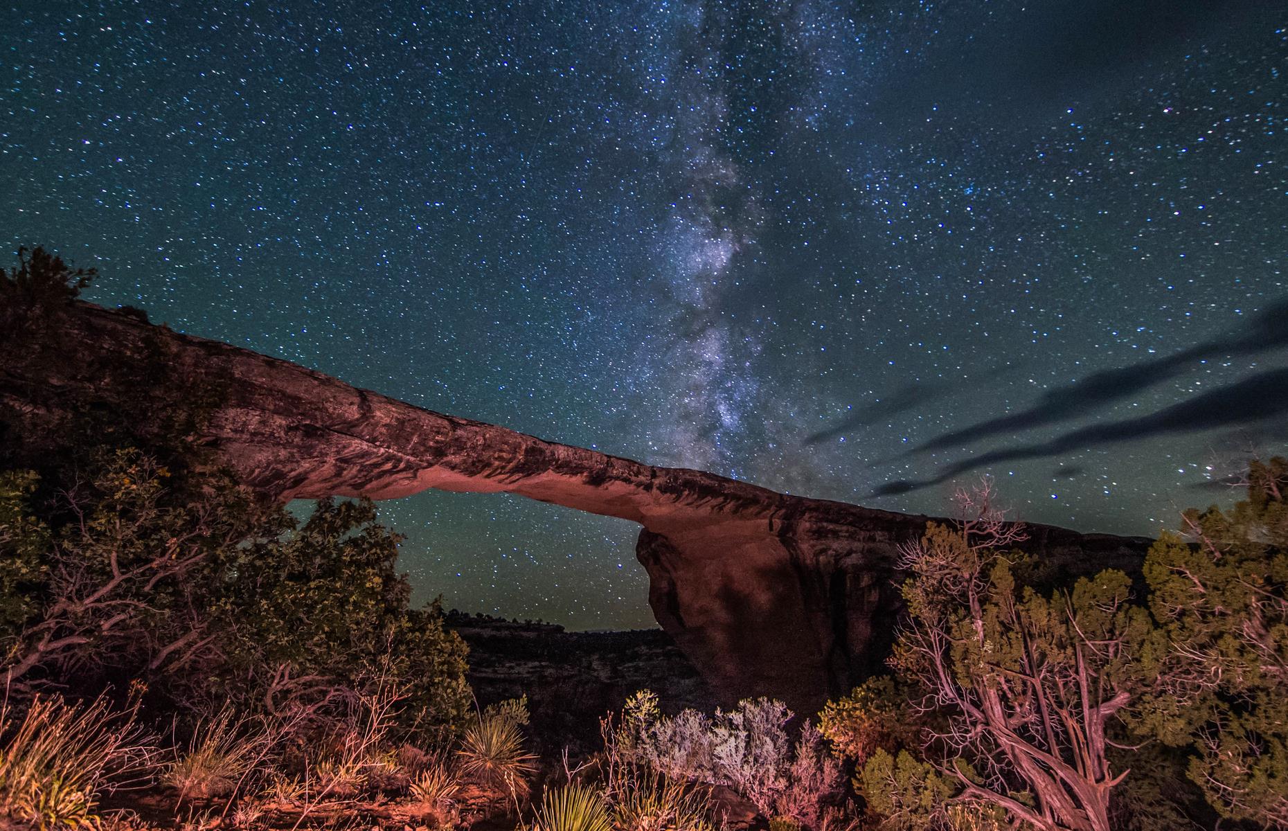 <p>The Natural Bridges National Monument – known for its wondrous arched rock formations like Owachomo Bridge (pictured) – became the world’s first International Dark Sky Park in 2007. Adventurous visitors are usually free to traverse Natural Bridges’ trails at any time of the day or night (<a href="https://www.nps.gov/nabr/index.htm">see the park website</a> for any updates). A night hike is the best way to drink in <a href="https://www.loveexploring.com/guides/87130/things-to-do-road-trip-south-utah">Southern Utah</a>'s starry skies, since the bridges aren't visible from any of the campgrounds here. </p>