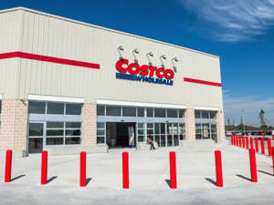 a sign in front of a building: If you’re a Costco member you already know how good the savings can be. But you might be missing out on even more perks that can wind up saving you even more. Here are 18 of the best benefits you might not even realize your Costco membership is getting you.   Related: 19 ways to make passive income in 2020 & beyond 