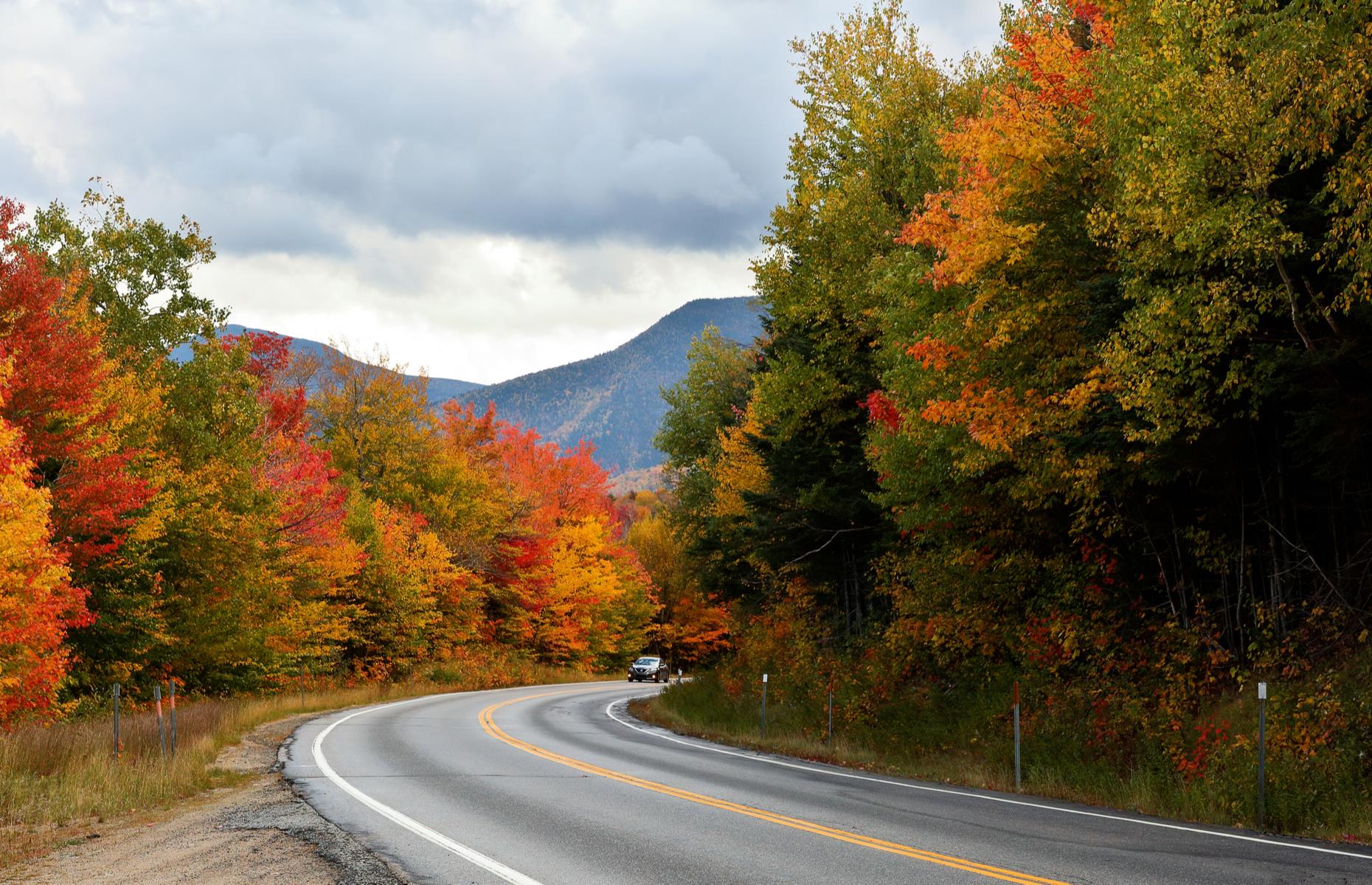 <p>Best traveled in the fall, this road-trip route takes the long way from the Strafford County city of Dover to the White Mountain town of Lincoln. The first stretch of the journey pushes north on NH-16 to reach Conway, a small town close to Echo Lake State Park (this park now requires <a href="https://www.nhstateparks.org/visit/state-parks/echo-lakes-state-park">an advanced day-use reservation</a>). From Conway, the driver is rewarded with stunning views as they travel on the famed Kancamagus Highway (pictured) through dense White Mountain forest to reach Lincoln.</p>