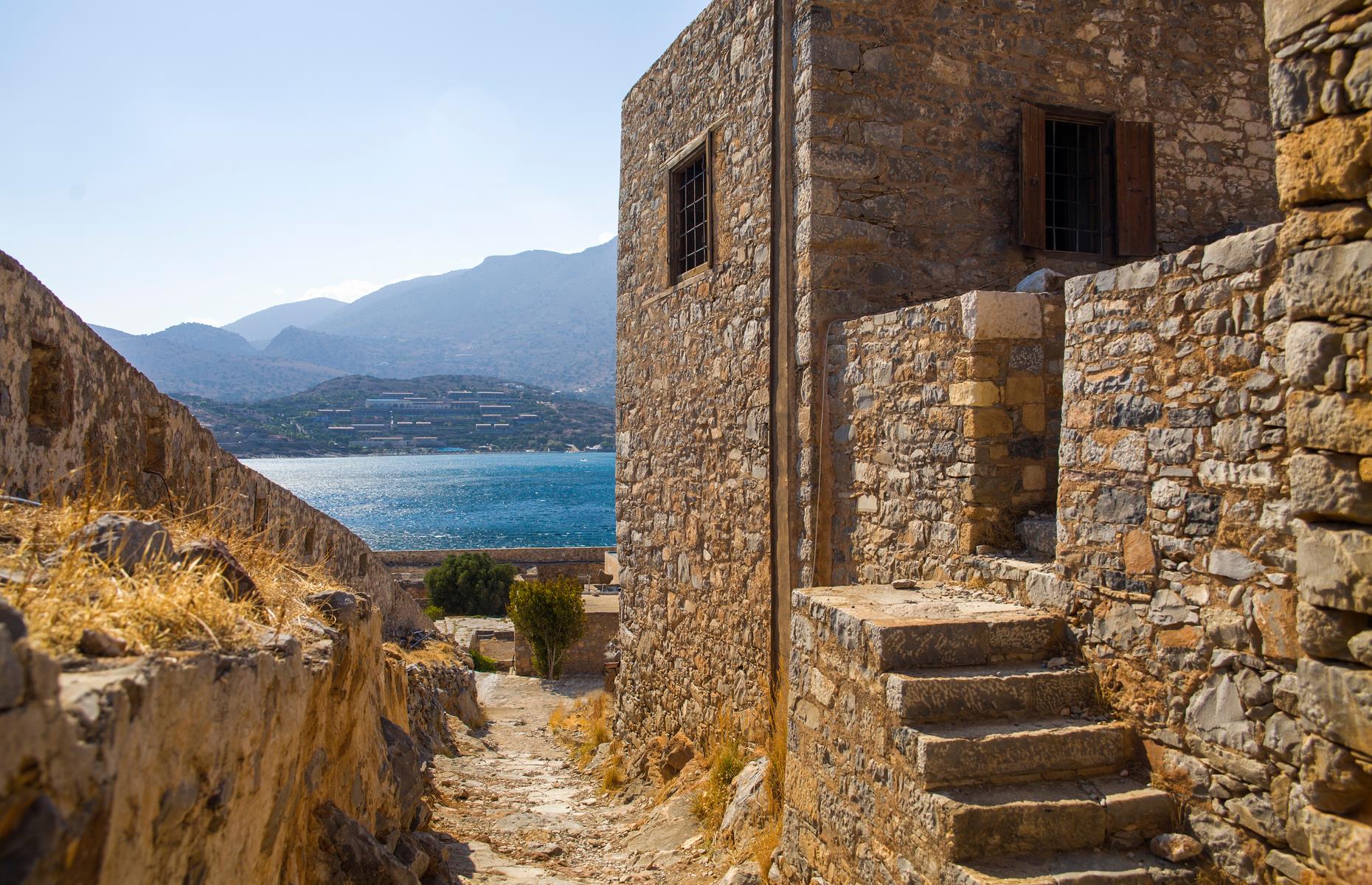 Slide 35 of 35: From the early 1900s, the rugged island was used as a leper colony with hundreds of sufferers finding themselves banished on Spinalonga. It's reported that only a single doctor operated here. The colony remained in operation until 1957, following the discovery of a treatment for the disease in the 1940s. Spinalonga remained all but forgotten until the 1980s when Victoria Hislop set her popular novel The Island here. Now tourists come from far and wide to wander the atmospheric ruins and learn more about the island's poignant history.