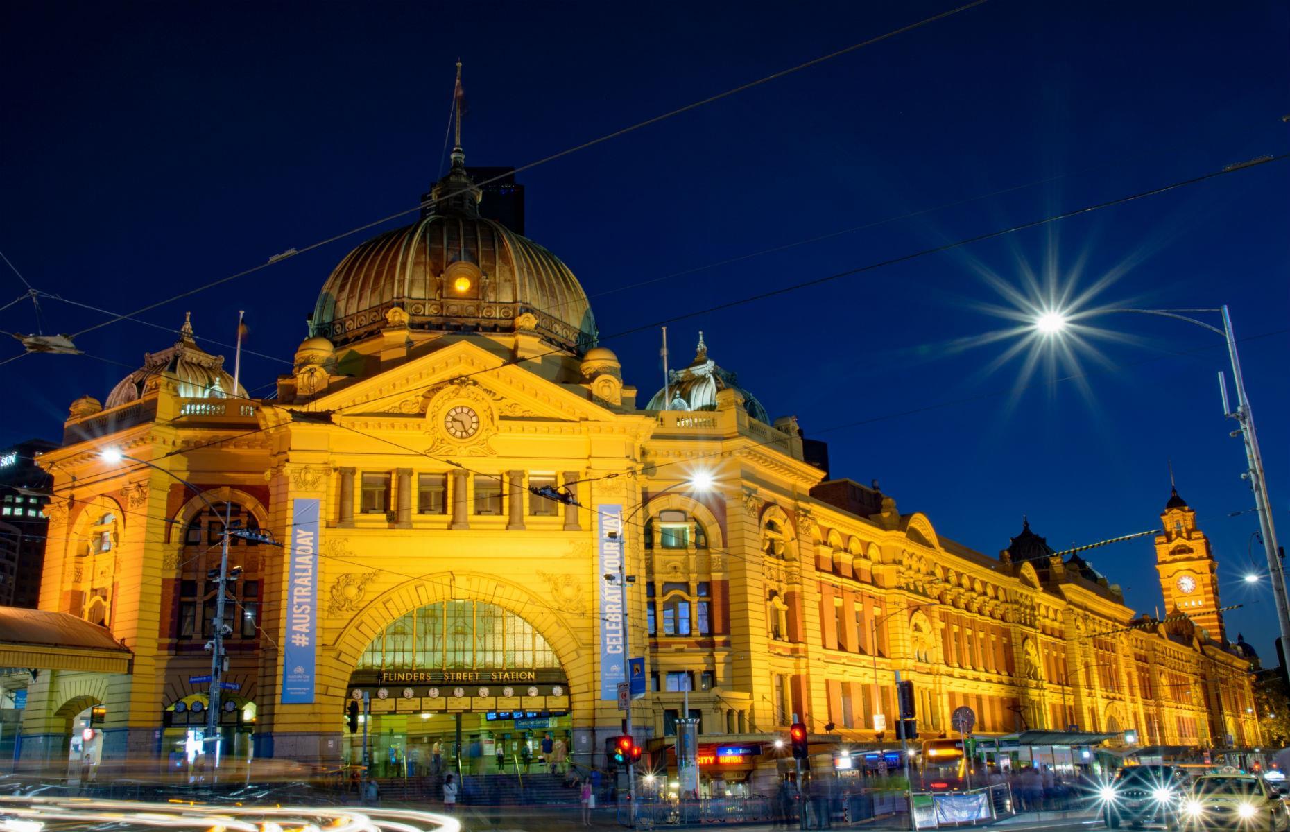 Slide 28 of 45: Melbourne’s Flinders Street Station is one of the city’s most beloved buildings. The first railway station built in an Australian city, the terminal has appeared in a number of movies and is well-known for the old-fashioned clocks displaying train departure times on its façade.