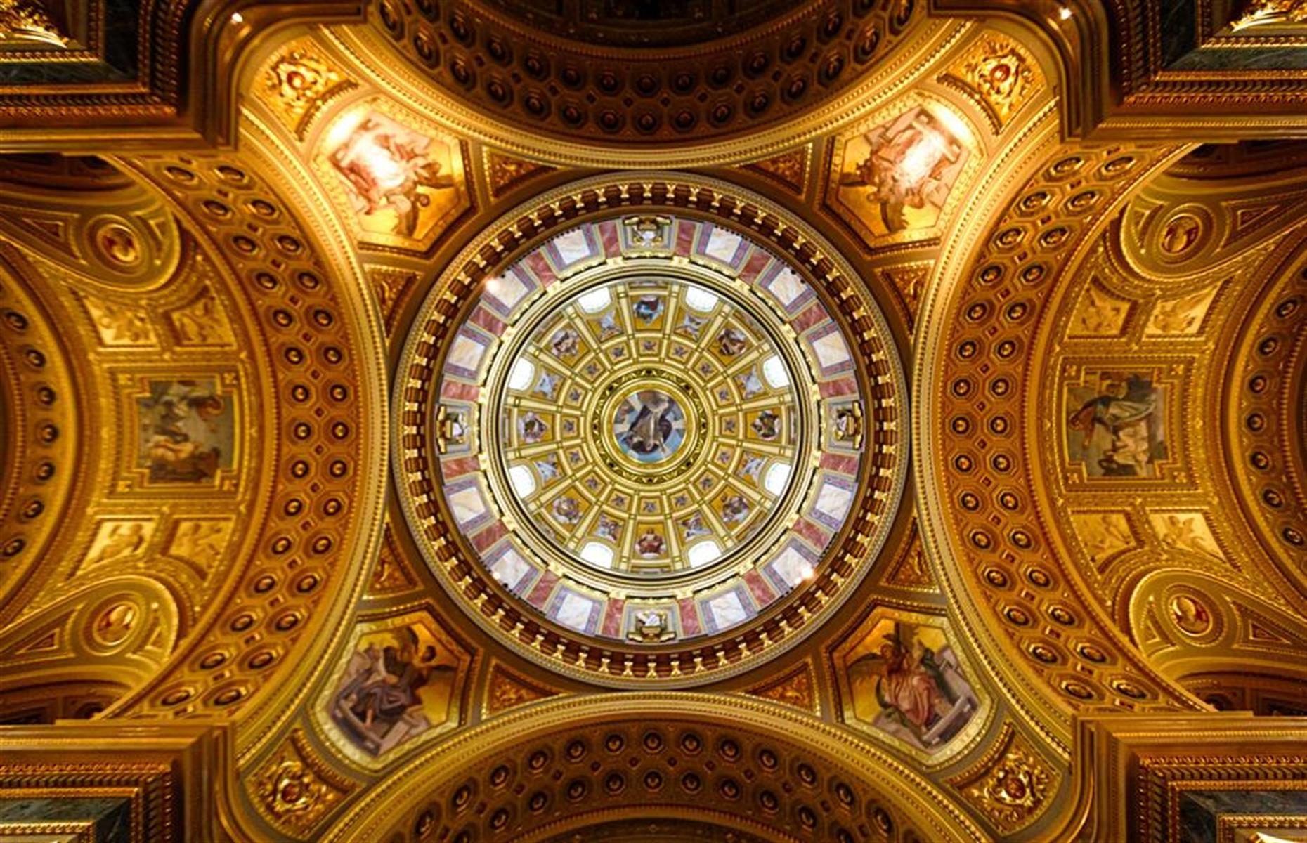 Slide 15 of 33: Budapest’s imposing 19th-century basilica is enormous. Sumptuous decorations flourish inside its cavernous interior, but look up and you’ll really be awestruck by the gleaming beauty of its dome. Little windows allow natural daylight to illuminate its frescoes and gold gilding. The place of worship was dedicated to St Stephen, the first king of Hungary. His mummified hand is kept in a glass case to the left of the main altar. For incredible city views, head up to the dome's observation deck, currently open.