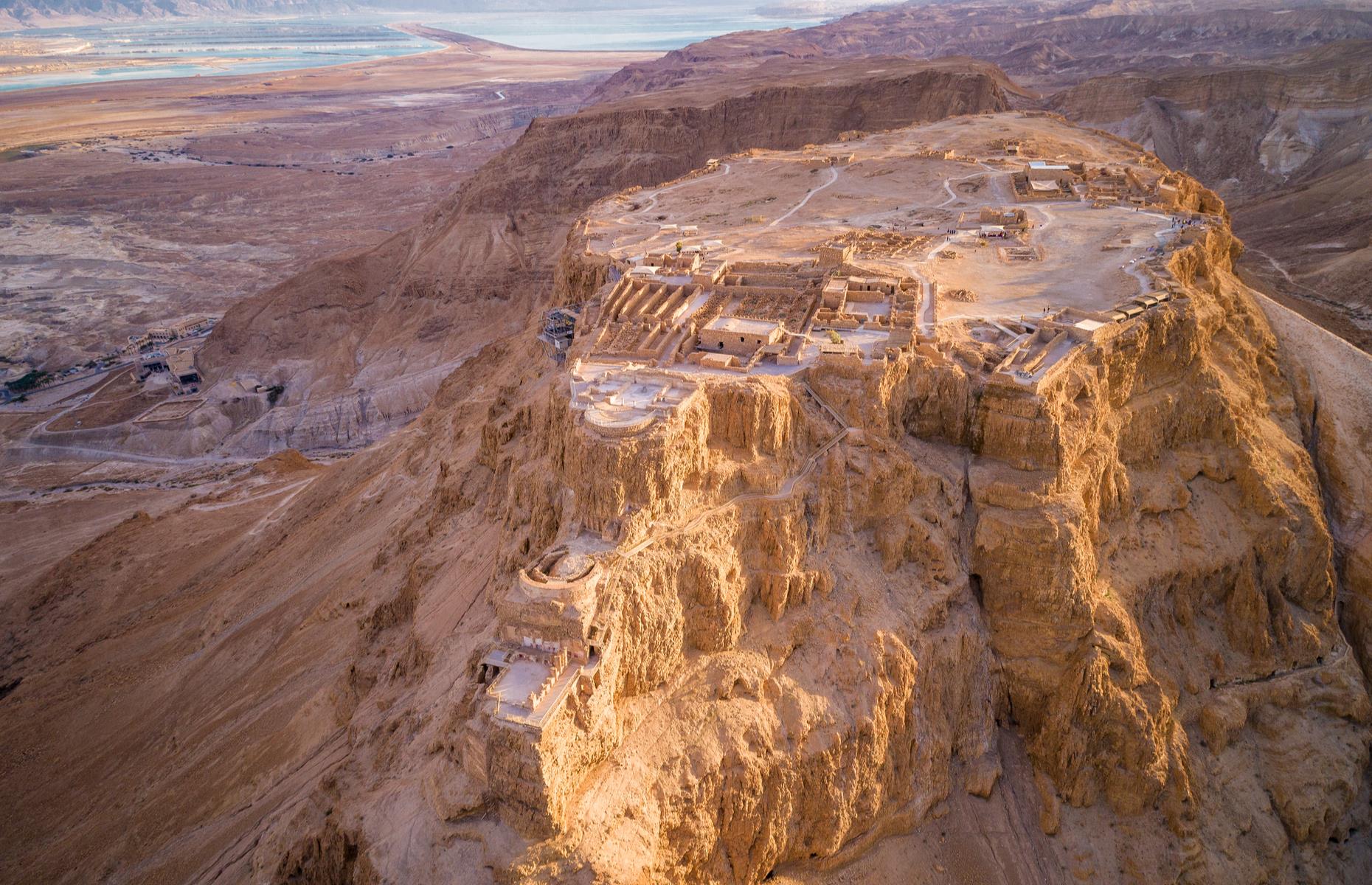 Slide 2 of 33: This rugged, impressive fortress in the middle of the Judaean desert is hewn into the rock face, blending in with the surrounding landscape. Built by King Herod in 30 BC, Masada is one of the most important archaeological sites in Israel. Its UNESCO-listed camps, fortifications and attack ramp that encircles the complex are incredibly well-preserved.
