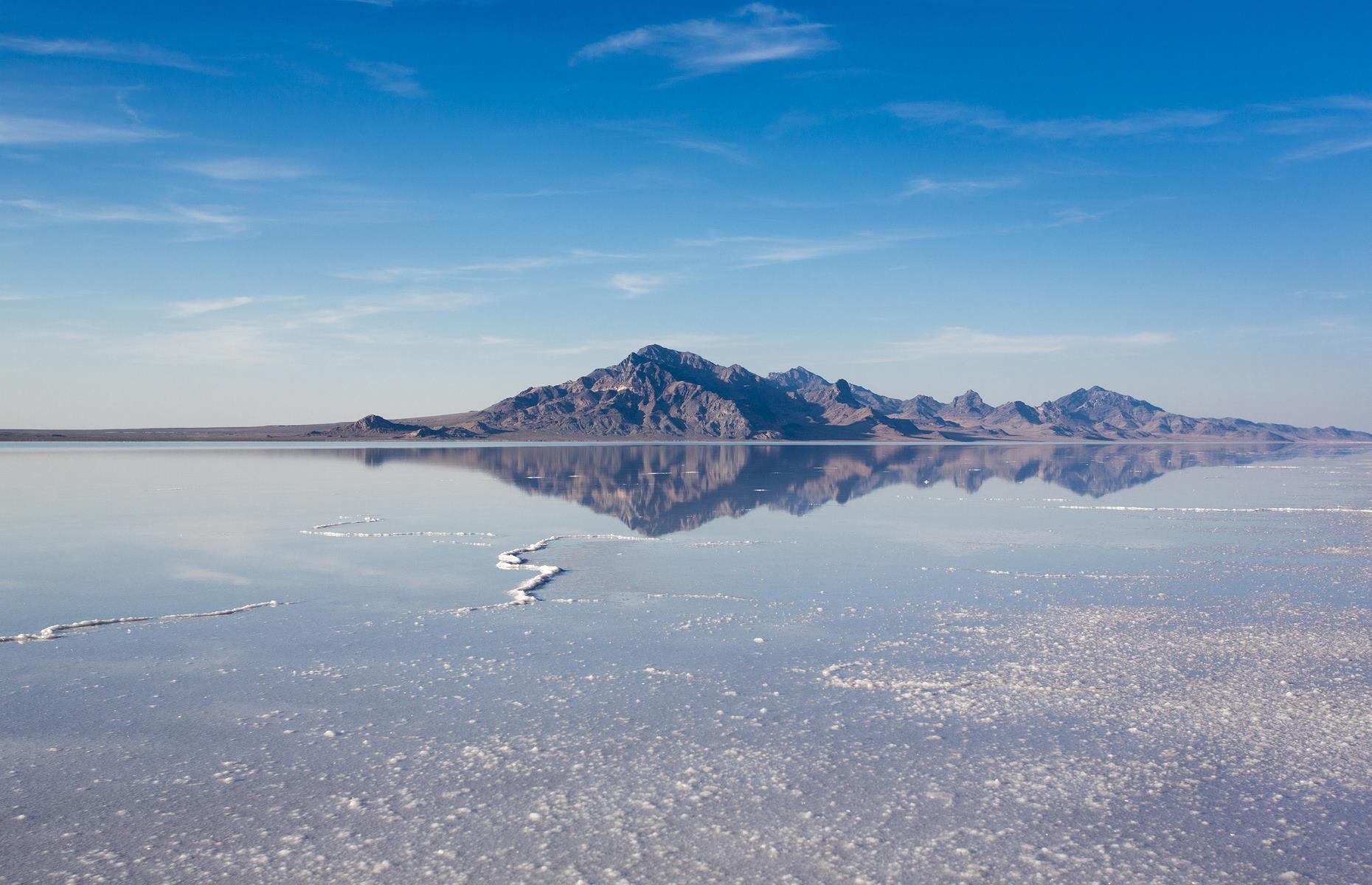 Almost a carbon copy of Bolivia's famed Salar de Uyuni, Bonneville Salt Flats in northwest Utah stretch for more than 30,000 acres. This was the original site of ancient Lake Bonneville: when the vast lake dried up, all that was left were salty deposits and a sprawling, flat plain. During the winter, a shallow pool of water sits upon the plain's surface acting as a giant mirror. The flats can be explored by car, but ensure you stick to the designated spots.