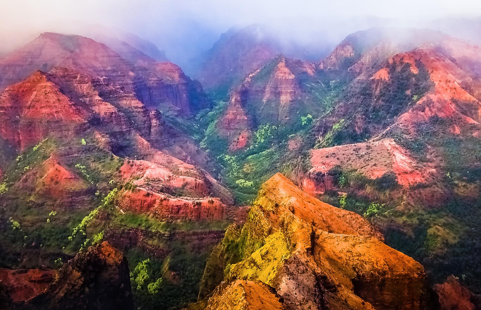 <p>The rugged red and green rocks of Hawaii's Nāpali Coast State Wilderness Park look more suited to Mars than Earth. 'Na Pali' means "high cliffs", and the tallest mountains here soar to 4,000 feet (1,200m). The best way to take in the prismatic peaks is from the Kalalau Trail, a hardy, 11-mile (17km) route that rewards its hikers with a sandy beach at the end. The trail reopened in 2019 (due to damage caused by flooding) and <a href="https://www.gohaena.com/">online reservations</a> are required in advance.</p>
