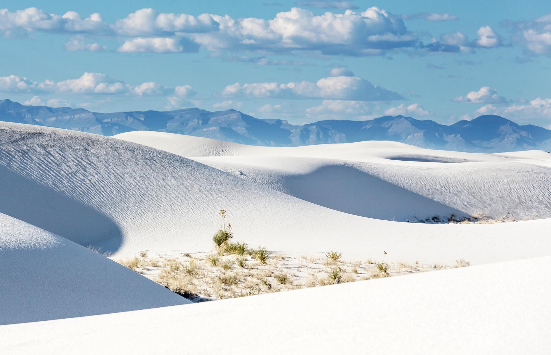 <p>This 275-square-mile (712sq km) desert in New Mexico's Tularosa Basin hardly looks as if it belongs on Earth, let alone in the USA. The dunes are made of gypsum sand, a rare mineral found in few places on the planet. Since gypsum sand (unlike regular sand) dissolves in water, it's a miracle to find it in such vast quantities – but this swathe of New Mexico has a climate dry enough to allow the grains to thrive. A ranger-led stroll at sunset is one of best ways to take in this most unique of landscapes but <a href="https://www.nps.gov/whsa/planyourvisit/conditions.htm">check the website</a> for the latest availability. </p>