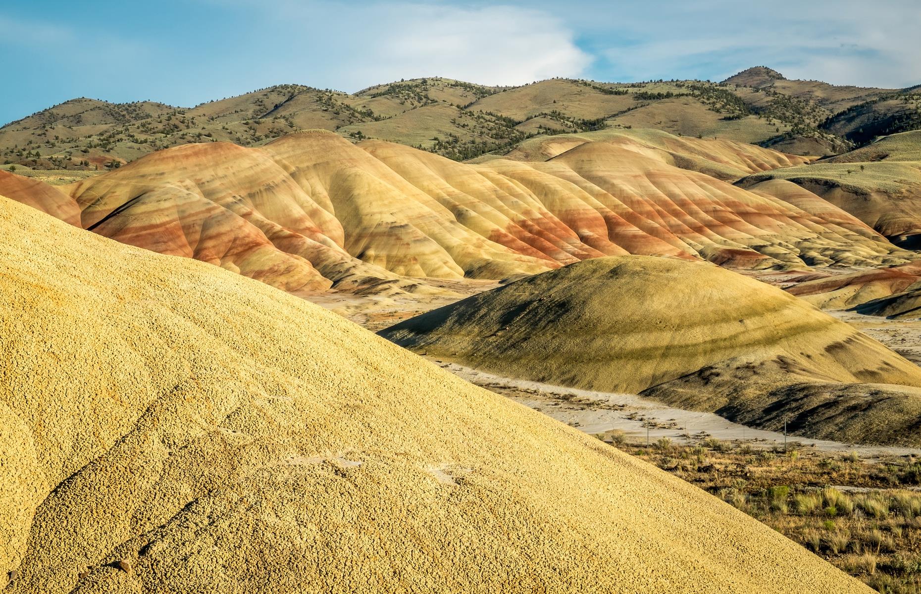 Reminiscent of China's Rainbow Mountains, this landscape is part of the John Day Fossil Beds National Monument. Streaked with yellow, amber and rust red, the ethereal hills got their color more than 30 million years ago, primarily from red ash left over by volcanic activity. They're criss-crossed with five hiking trails: opt for the Carroll Rim Trail for sweeping panoramas, or the Leaf Hill Trail for a deep dive into the history and palaeontology of the area.