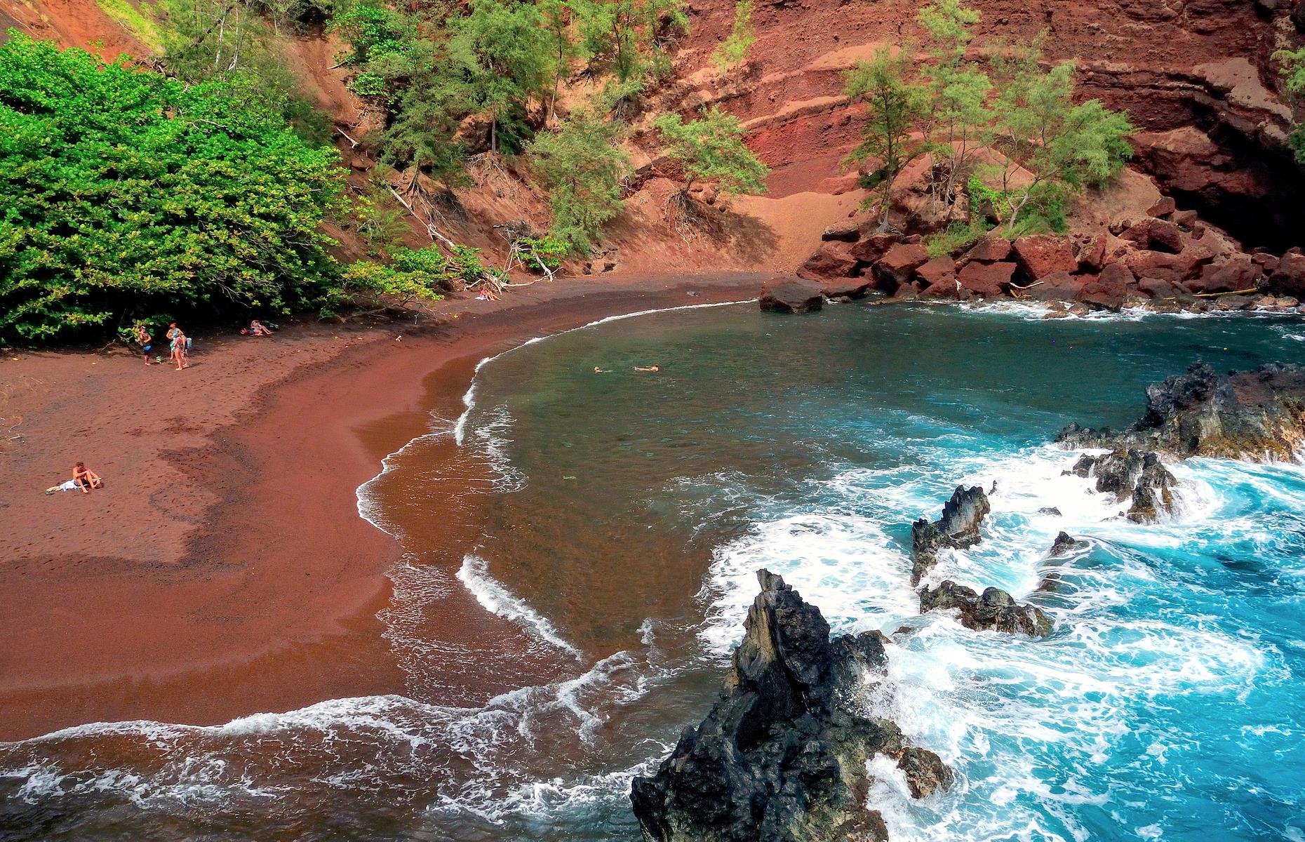 Also known as Kaihalulu Beach, this rust-colored strand on Maui is gloriously secluded, its sand contrasting with the bright blue waters lapping at the shore. The ruddy hue is the result of the ever-eroding volcano that backs the crescent. The beach can be reached via a steep, narrow trail (note that many consider the trail dangerous, hence the beach's relative seclusion), and there are no facilities, so come prepared.