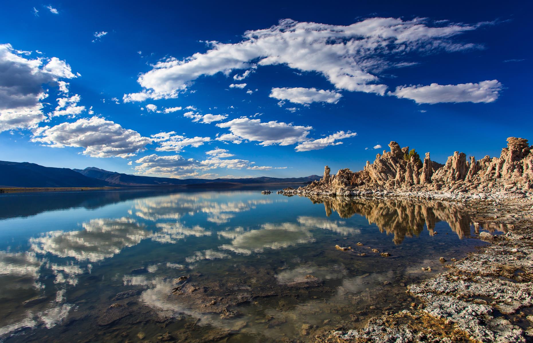 <p>A vast body of saltwater in California's Eastern Sierra, Mono Lake is around 70 square miles (181sq km) in total. Aside from the clouds reflected in its glossy expanse, the water is characterized by the so-called "tufa towers", craggy limestone stacks that rise from the lake's surface. Various expert-led tours of the area offer an insight into the local wildlife, and usually a guided canoe or kayak trip allows you to see the lake's rock formations up close, although these have been canceled for the 2020 summer season. You can however still explore the region independently.</p>