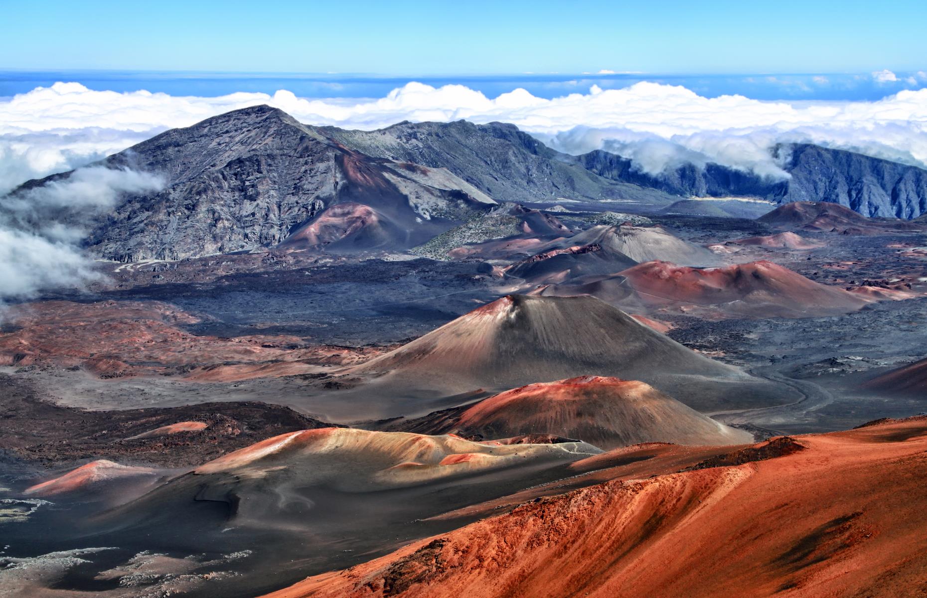 <p>These Mars-like landscapes exist in the remote Summit District of Hawaii's <a href="https://www.nps.gov/hale/index.htm">Haleakalā National Park</a>. Here, the namesake Haleakalā, a gargantuan shield volcano, reaches 10,023 feet (3,055m), and brave hikers come to spot native flora and fauna and experience some of the best stargazing in the state. Elsewhere in the park, the Kīpahulu District complements the Summit with its waterfalls, greenery and rugged coastline. </p>