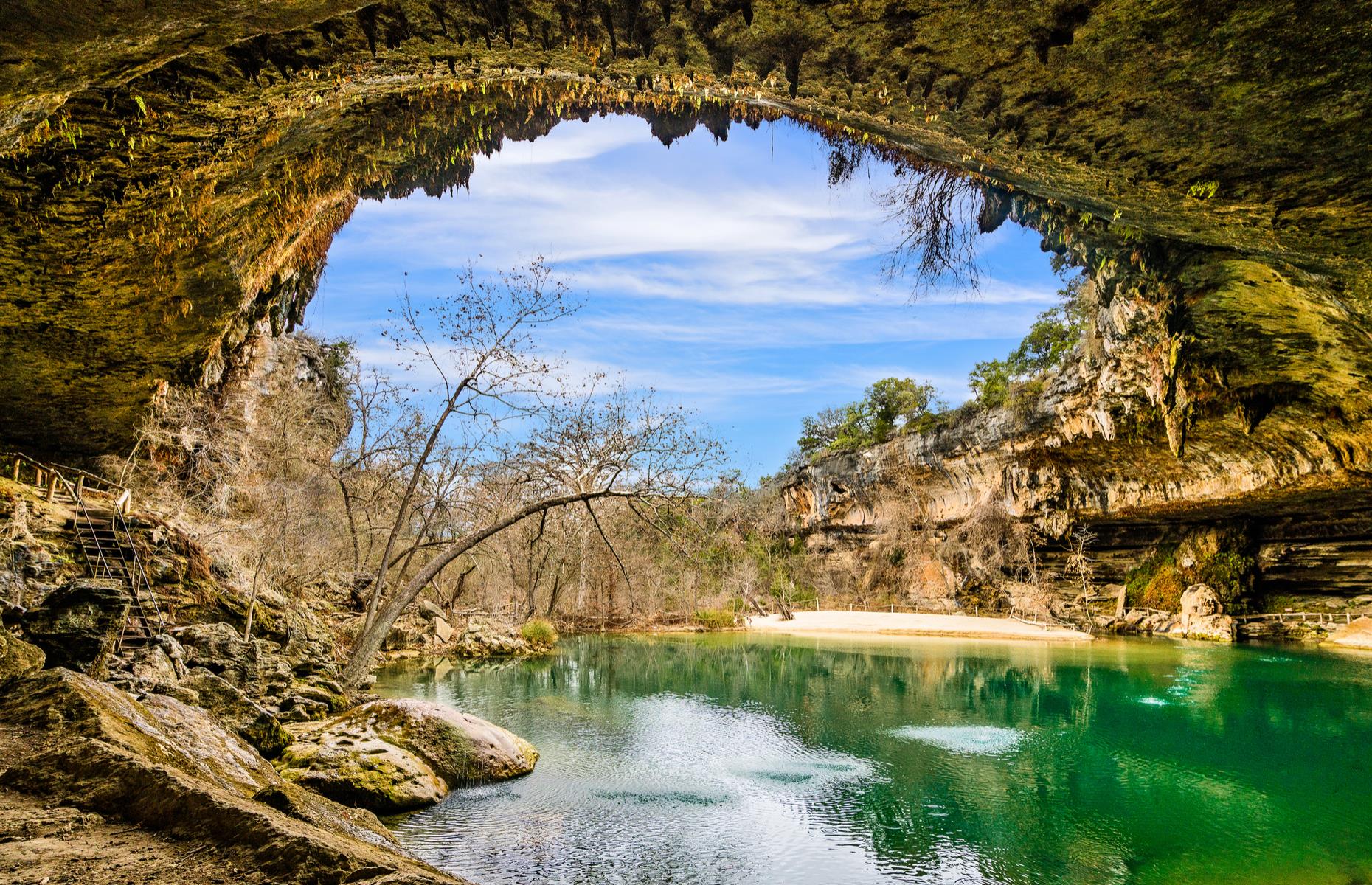 <p>This natural swimming hole wouldn't look out of place in the Mediterranean – in fact it's just over 20 miles (32km) west of Austin. A 50-foot (15m) waterfall feeds the green pool, which was once entirely underground, before the sheltering limestone roof above it collapsed. The pool is usually a popular spot for a dip in the summer months and normally you'll need a reservation to access it, although <a href="https://parks.traviscountytx.gov/parks/hamilton-pool-preserve">the site is currently closed</a> due to COVID-19. </p>