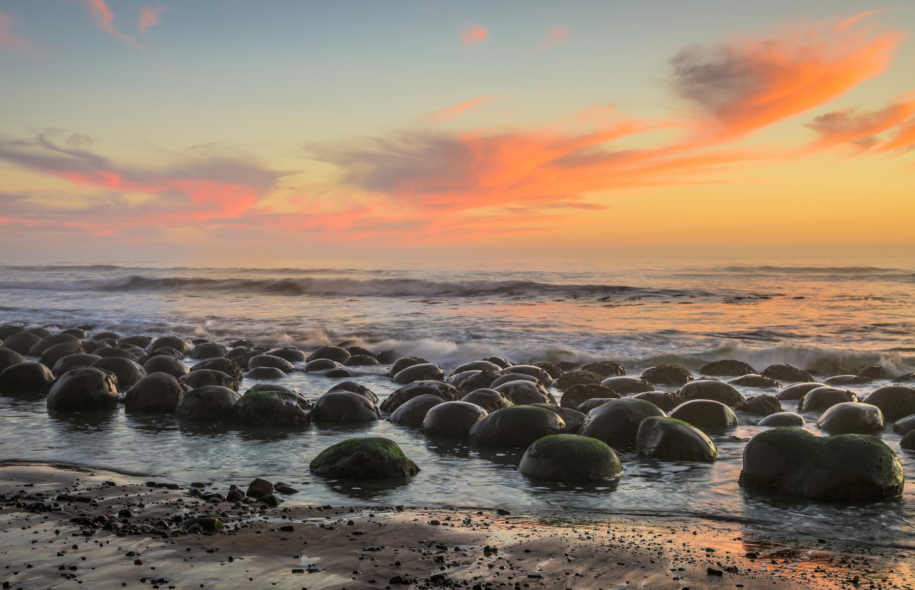 You'll find this distinctive stretch of shoreline in the northern part of Schooner Gulch State Beach. It appears as though hundreds of bowling balls have been rolled out to sea and become wedged in the sand. The phenomena is in fact caused by decades of erosion and "concretion", where sediment clumps together to form larger rock formations, in this case neat sandstone spheres. Time your visit for low tide for the best view.