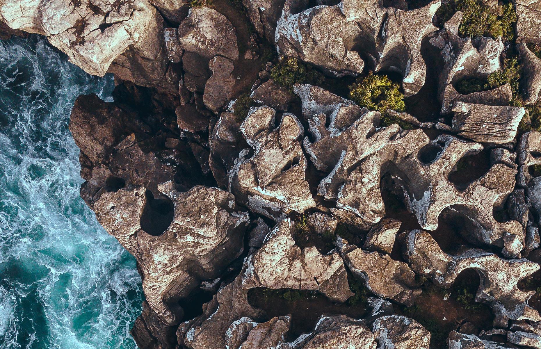 <p>This wave-beaten outcrop is the most westerly point in Europe, situated in Portugal's Peniche area. From up high, the drama of the natural rock formations come into the fore. Beaten into shape over many years by wind and water, the crags look like mismatched jigsaw puzzles, with determined greenery forcing its way through the cracks. </p>