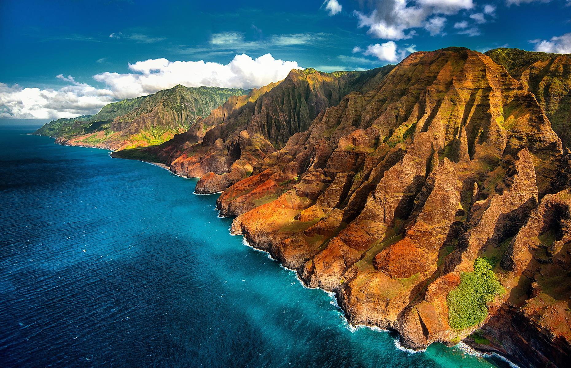 <p>The gorgeous forest-covered cliffs of the Nā Pali Coast State Wilderness Park on Kauai Island are an exquisite sight to see. Like something straight out of the <em>Jurassic Park</em>, some of the rugged red and green rocks of Hawaii's Nā Pali Coast State Wilderness Park look more suited to Mars than Earth. Nā Pali means high cliffs in Hawaiian – a very fitting name when the tallest mountains here soar to 4,000 feet (1,200m). </p>