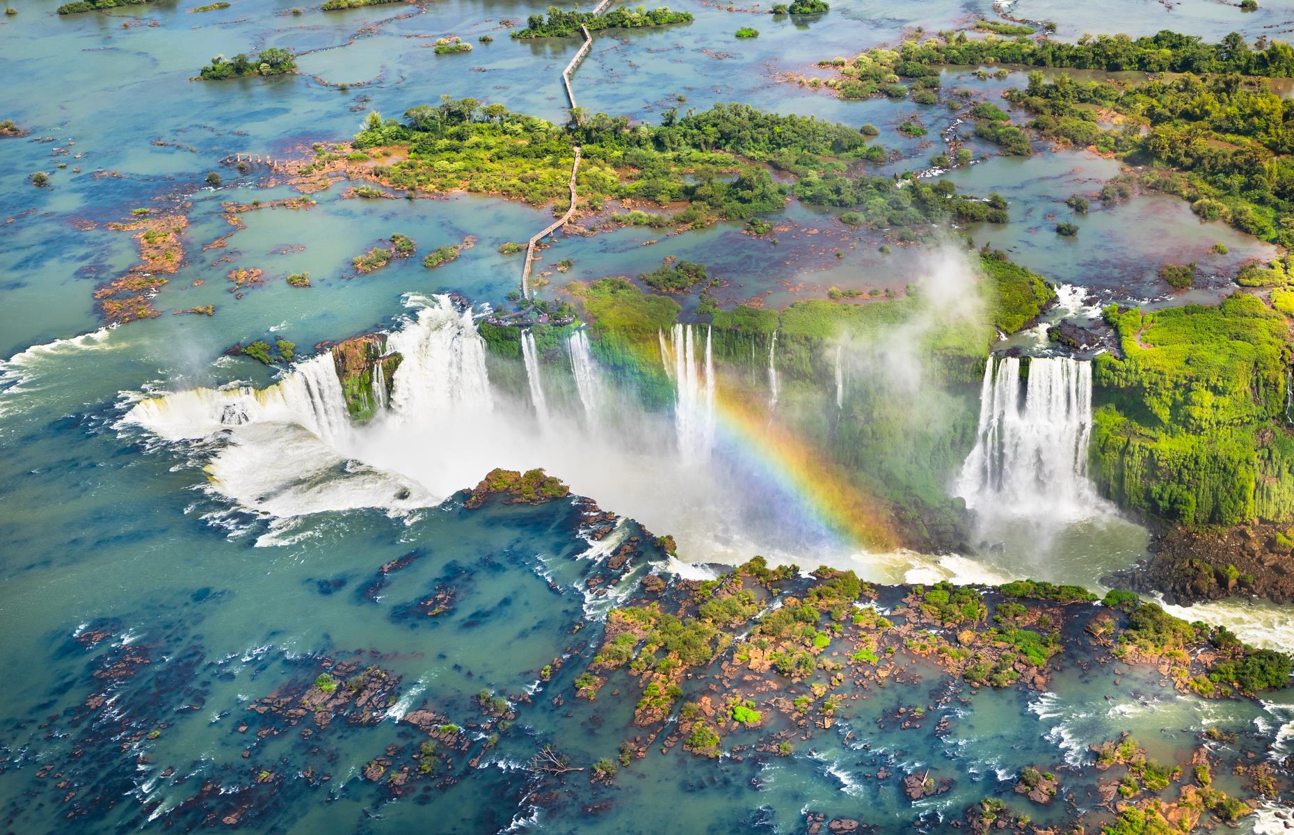 When one waterfall just isn’t enough, there’s Iguazú Falls – the world’s largest waterfall system and certainly among the most awe-inspiring sights. The chain of cascades, which encompasses more than 270 waterfalls and covers 1.7 miles (2.7km), straddles the border of Brazil and Argentina, and flows in a staircase formation. Its setting, in the heart of a national park thick with rainforest, is equally beguiling.