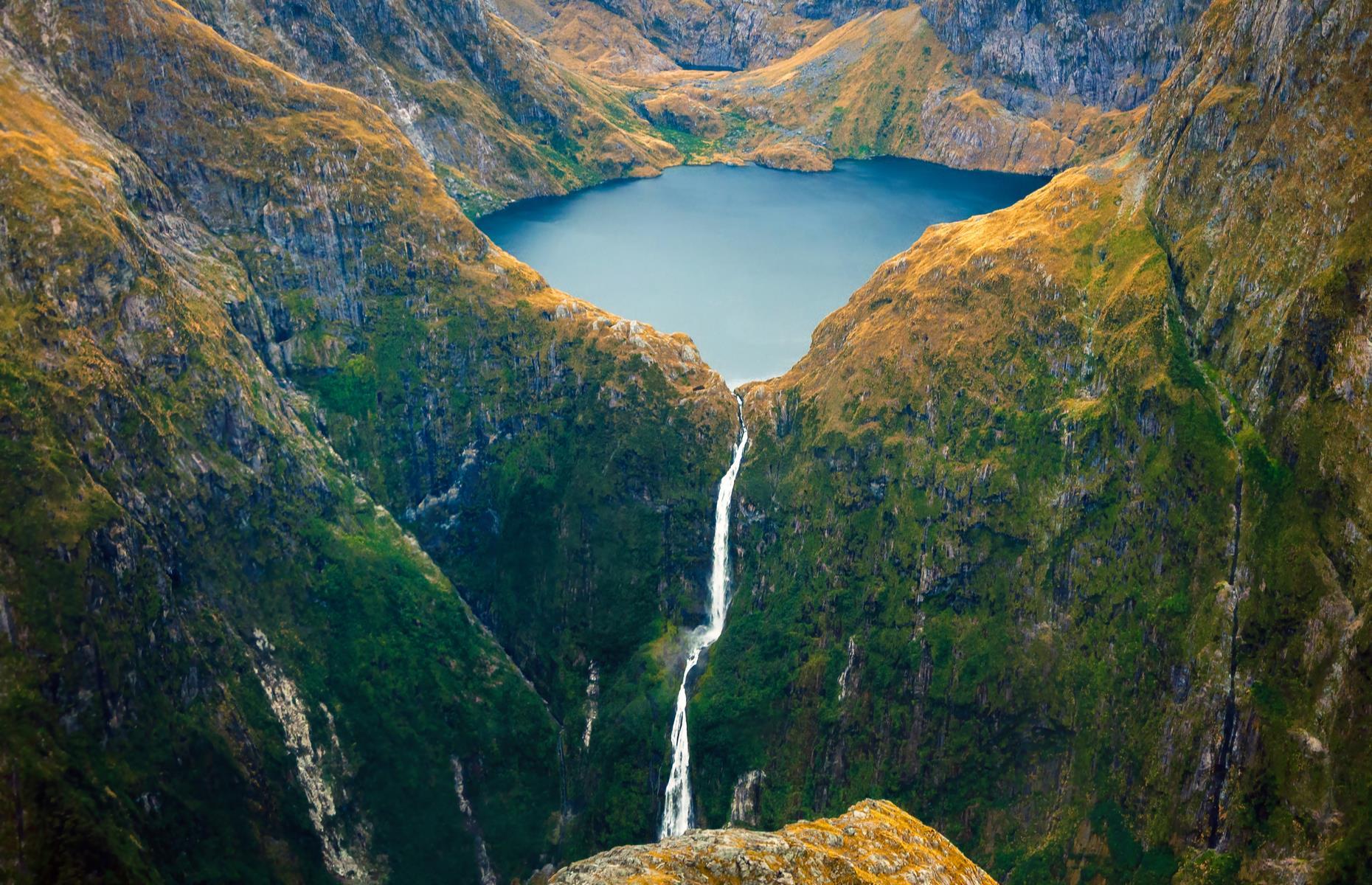 <p>Located in the remote part of Fjordland in the South Island, Sutherland Falls is made up of three streams that thunder from a height of 1,904 feet (580m) – putting it among the world’s tallest. There’s often not a soul around to hear their roar as the falls are tucked within remote bushland, with water flowing from Lake Quill. Here are <a href="https://www.loveexploring.com/galleries/75334/50-reasons-you-must-visit-new-zealand-in-2020">50 more reasons to love New Zealand</a>.</p>