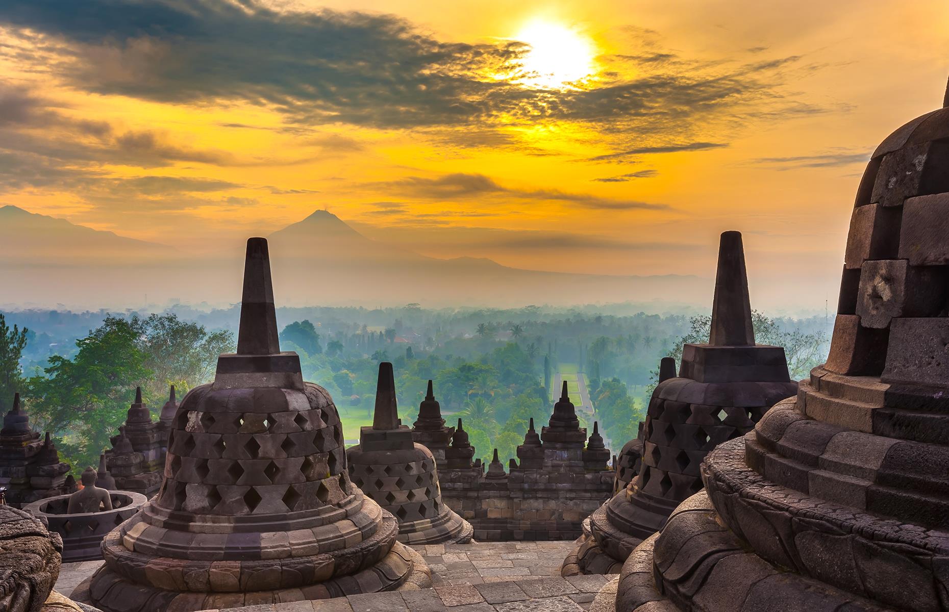 <p>Few sights rival that of sunrise over Borobudur, the world’s largest Buddhist temple, with Mount Merapi in the distance. Yet there is a dark paradox behind the serene image: Merapi is volcanic, and many scientists now believe that eruptions and earthquakes between 928 and 1006 led monks to abandon Borobudur. The Mataram Kingdom erected Borobudur in around AD 824. That means it enjoyed barely 200 years of use before the forest reclaimed it. It was re-discovered by British and Dutch explorers in 1814.</p>