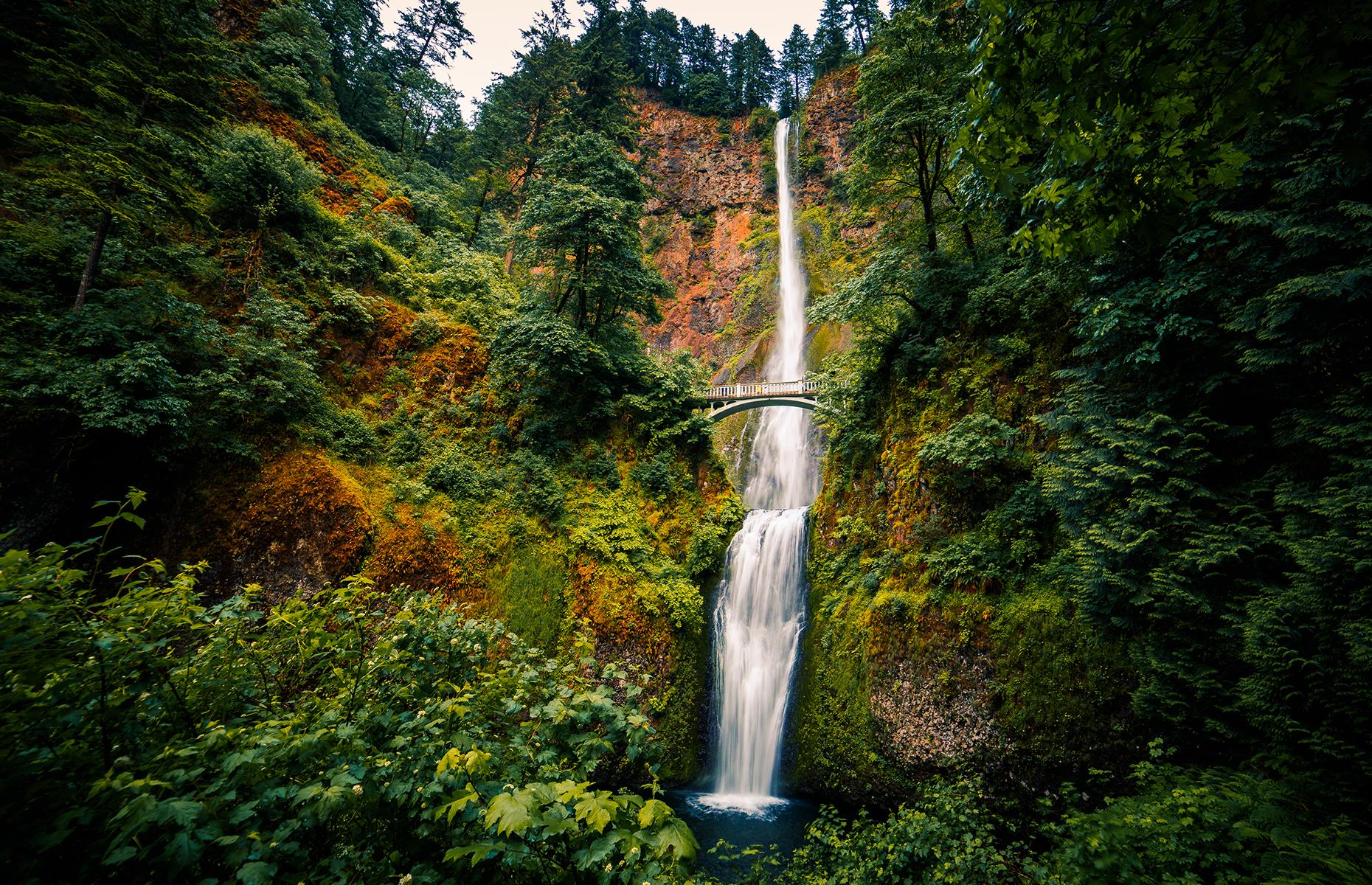 Slide 32 of 41: It's hard to believe that this towering waterfall is just a 30-minute drive from Portland. Crashing over more than 600 feet (182m) of craggy bluffs, the two-tiered waterfalls collect in a deep blue pool at the base. It's equally stunning when viewed from the base or from Benson Bridge. Built in 1914 and refurbished after a damaging fire, it's close enough to feel the spray from the waterfall.