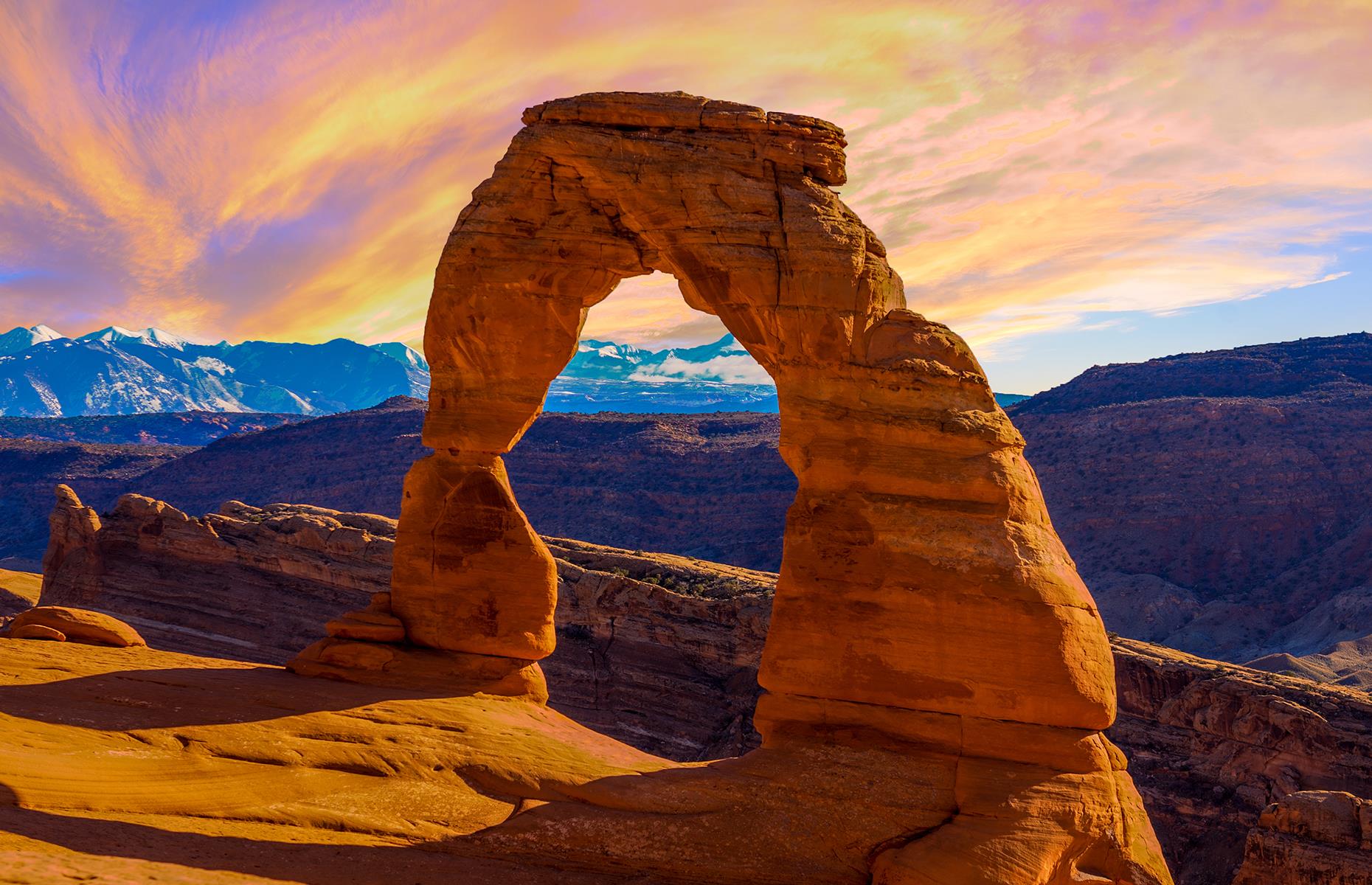Slide 40 of 41: With the highest density of natural arches in the world, the Arches National Park boasts more than 2,000 natural red sandstone structures, the most famous being the Delicate Arch. The 52-foot (16m) freestanding arch is among the park's most popular attractions and there's a 1.5-mile (2.4km) hiking trail leading up to the famous formation.