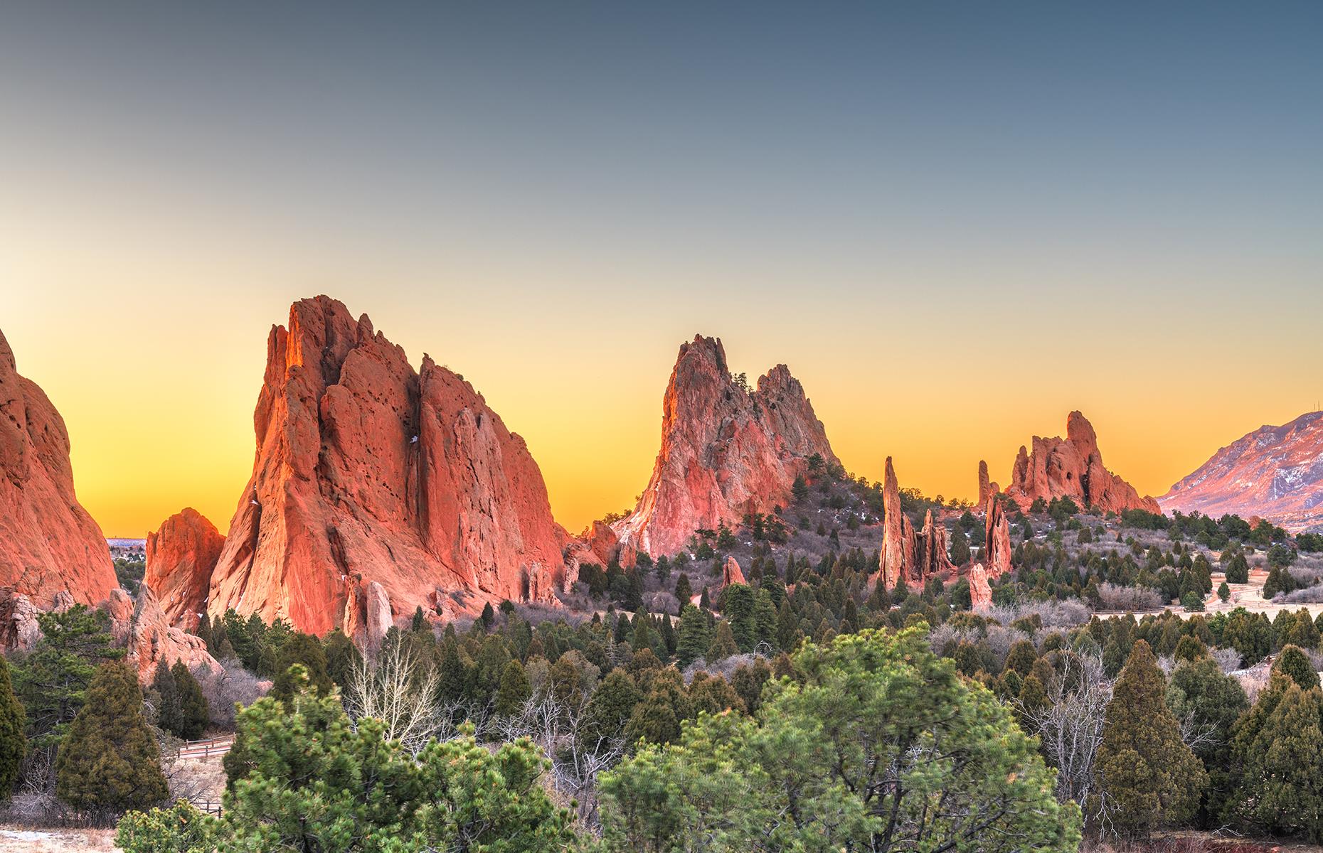 Slide 8 of 41: Located in the heart of Colorado Springs, the Garden of the Gods is a National Natural Landmark defined by towering rock formations, consisting of red, pink and white sandstone as well as limestone. There are interactive expositions on offer to better understand how these unique rocks were formed.