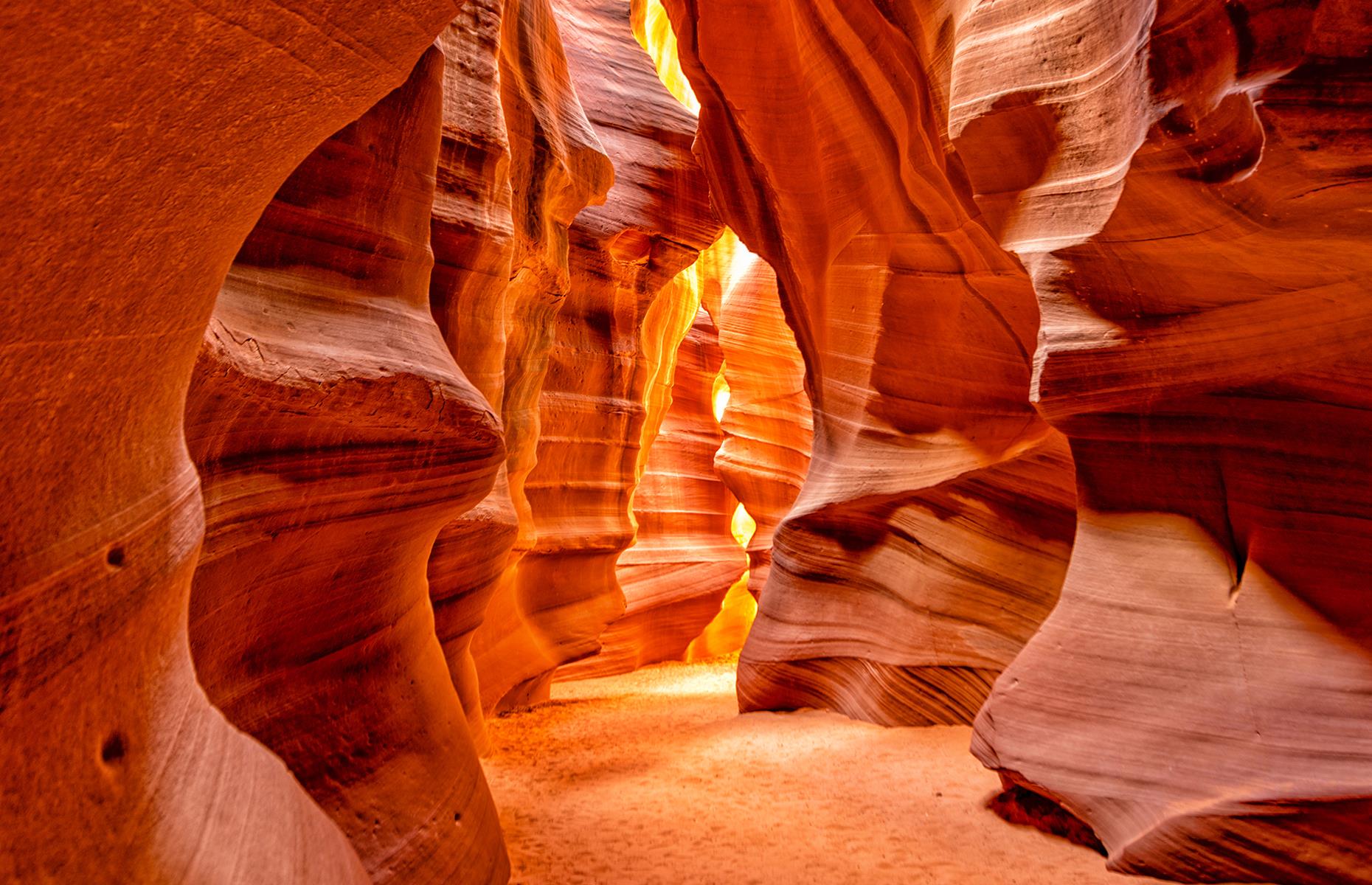 Slide 5 of 41: These ethereal slot canyons – divided into two sections known as The Crack and The Corkscrew – can only be explored on a guided tour with a native Navajo guide, however tours are temporarily suspended at present. It's thought that the canyon was formed by flash flooding during monsoon season which explains the smooth, flowing shapes of the walls.