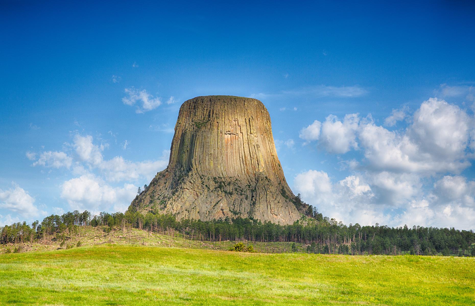 Slide 35 of 41: Devils Tower is impossible to miss – the 1,267-feet-tall (386m) rock soars high above the surrounding countryside. Made famous by Steven Spielberg’s Close Encounters of the Third Kind, Devils Tower is also a sacred site to more than 25 Native American tribes. There’s a path winding its way around the base of the tower, offering a chance to see it from all angles.