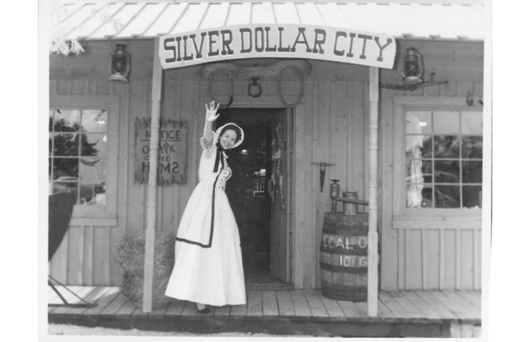 Slide 16 of 35: Thoroughly committed to its 1880s theme, Silver Dollar City had its start in the 1950s when the Herschend family set to work creating a replica mining town. In 1960, they opened the attraction, named Silver Dollar City, to the public – it was complete with an ice-cream parlor, a blacksmith's shop and a general store. The latter is pictured here in the 1960s.