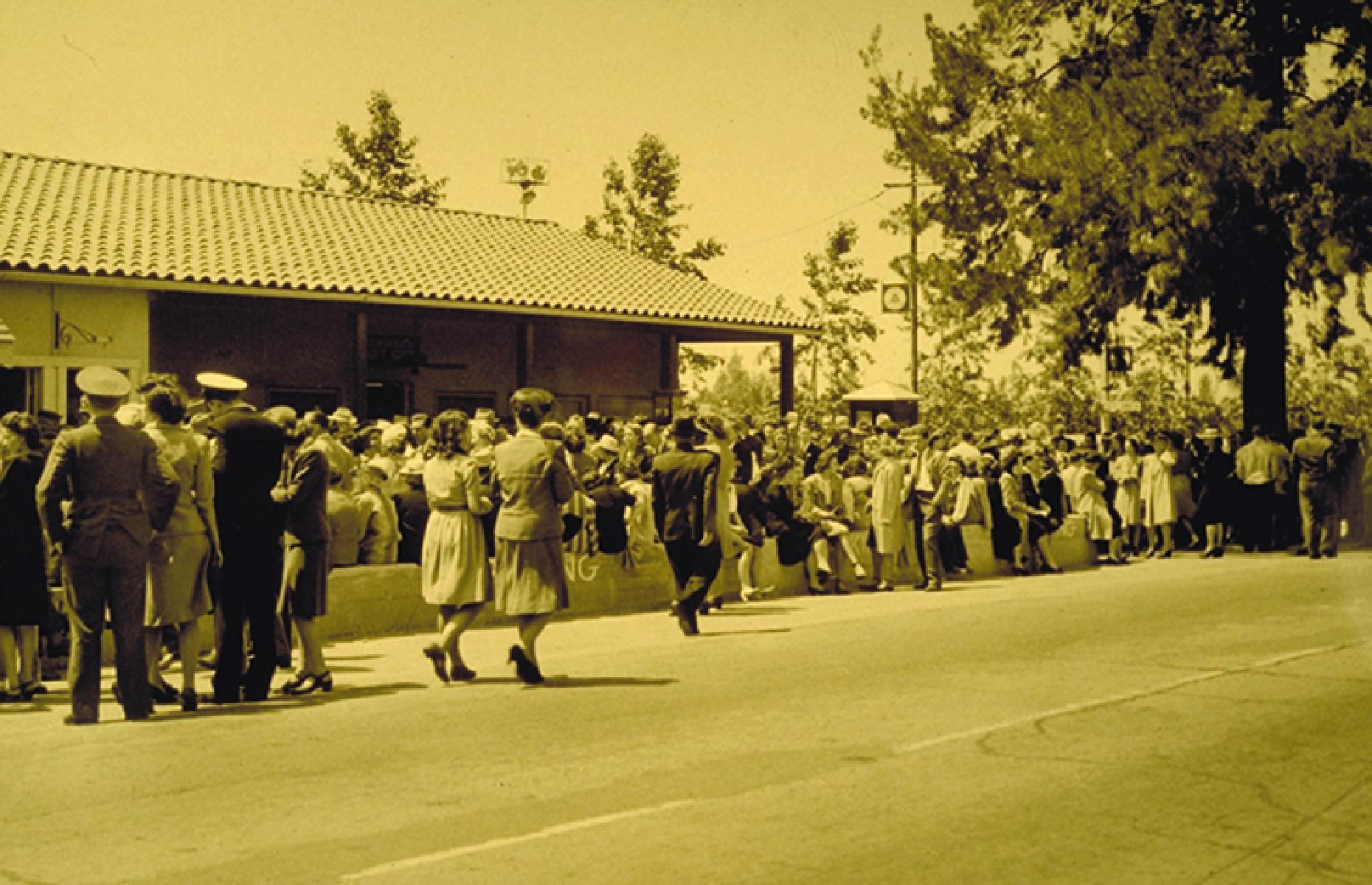 Slide 8 of 35: The Knotts didn't rest on their laurels though, and with the Great Depression posing a major challenge to business owners, the couple decided to add another string to their bow. In the 1930s, Cordelia began selling her famous fried chicken dinner from a tea room on the property, and hungry diners would line up in their hundreds (pictured). Mrs. Knott's Chicken Dinner Restaurant is still a top attraction at the park today.