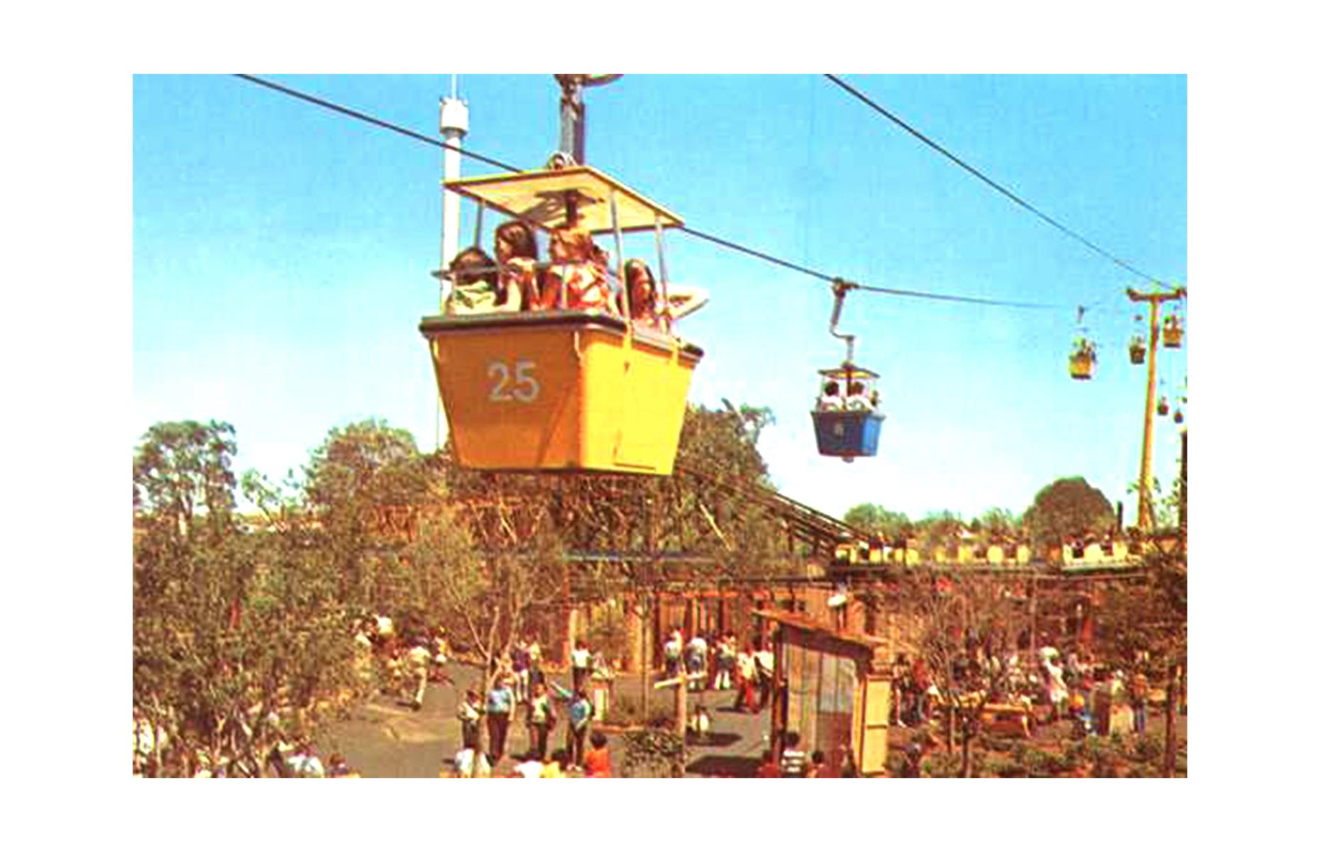 Slide 22 of 35: North Carolina's Carowinds, now in the Cedar Fair Portfolio, began life as a charming park themed around the history of the Carolinas. And, luckily, it had immediate appeal: more than one million visitors poured through its gates in the very first season. While the 1973 oil crisis prevented the park's growth for a while, it remains a regional favorite today, attracting thrill-seekers from the Carolinas and beyond. The Skyway (pictured) was one of the opening attractions, granting riders sweeping views of the park until the ride's closure in 1981. 