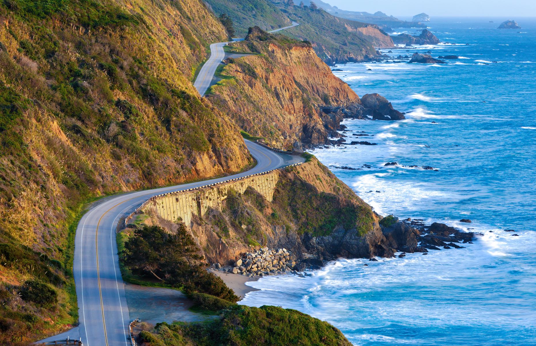 <p>It’s the classic, top-down, sunglasses on, sunny grin permanently plastered across your face road trip, and every weave and wiggle in this ocean-skimming route – also known as Highway 1 – is pretty ruddy gorgeous. Yet, somehow, <a href="https://www.visitcalifornia.com/uk/destination/spotlight-big-sur">Big Sur</a> manages to dial up the drama even more. As the highway curls around this portion south of San Francisco, the cliffs feel closer, the sand creamier, the redwoods taller, and the water more intensely teal and turquoise. <a href="https://www.loveexploring.com/guides/88203/californias-central-coast-road-trip-the-top-things-to-do-where-to-stay-">Don't miss our guide to California's Central Coast</a>.</p>