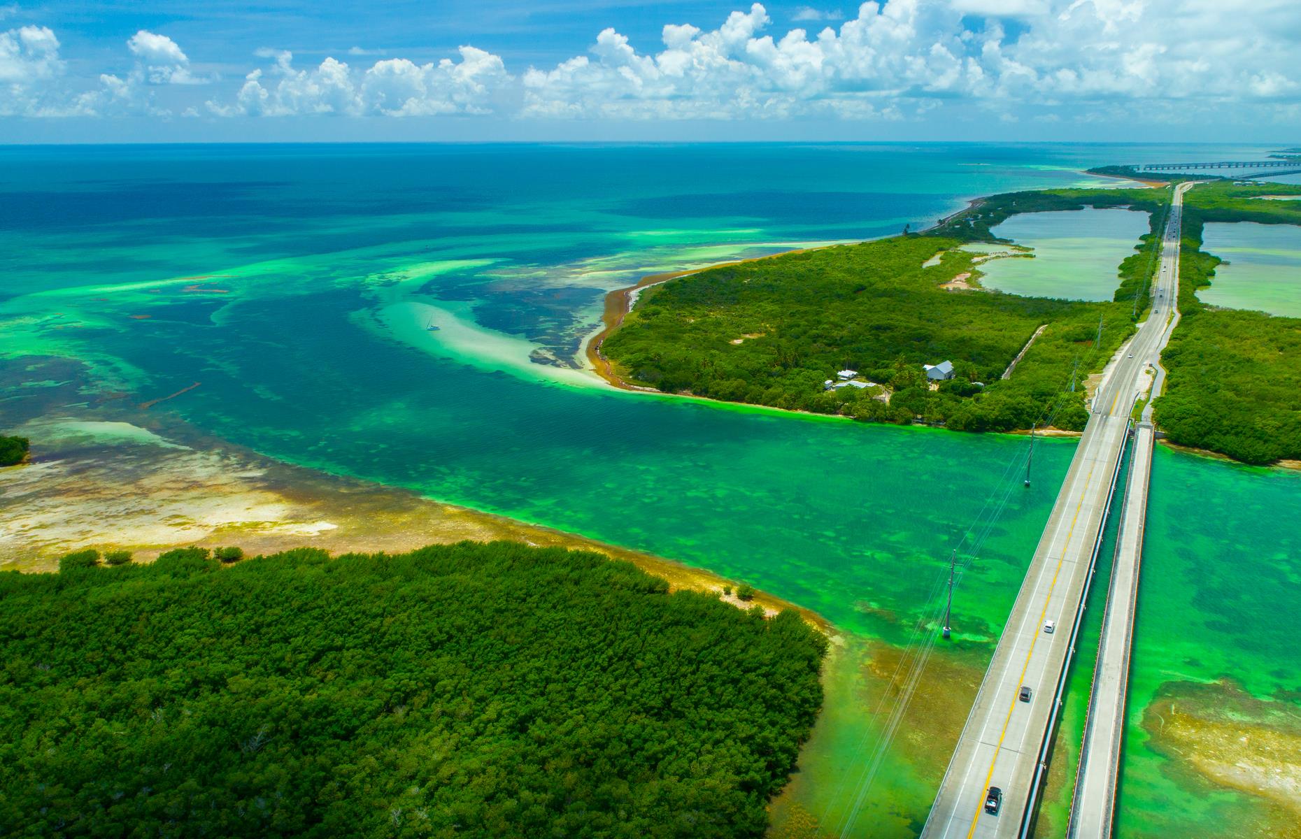 <p>The US1 stretches all the way down the east coast, from Fort Kent in Maine to Key West in Florida. It reaches new peaks of perfection in the <a href="https://www.loveexploring.com/guides/73827/explore-the-florida-keys-where-to-stay-what-to-eat-the-top-things-to-do">Florida Keys</a>, however. This portion is known as the Overseas Highway for good reason: it feels like your tires are grazing the water’s surface as low bridges soar over the dappled blue-and-green water of the Florida Straits. <a href="https://www.loveexploring.com/guides/85940/south-florida-road-trip-the-top-things-to-do-where-to-stay-what-to-eat">Check out our brilliant itinerary around southern Florida</a>.</p>