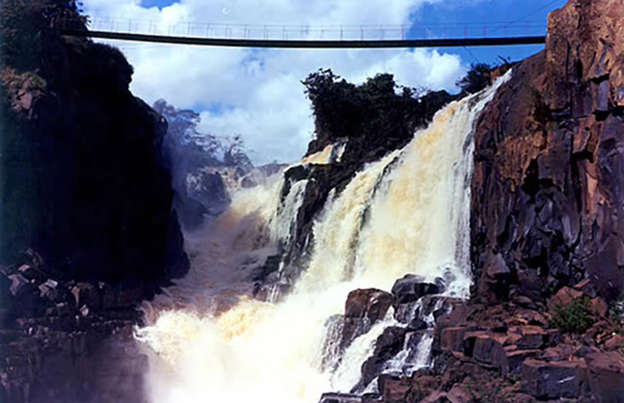 Slide 16 of 39: Thirty-seven years ago, on the border between Paraguay and Brazil, there lay one of the most powerful waterfalls in the world. Comprising a series of 18 falls, with the tallest 130-feet (40m) high, this natural wonder attracted tourists from across the globe, who were captivated by its immense power and beauty.