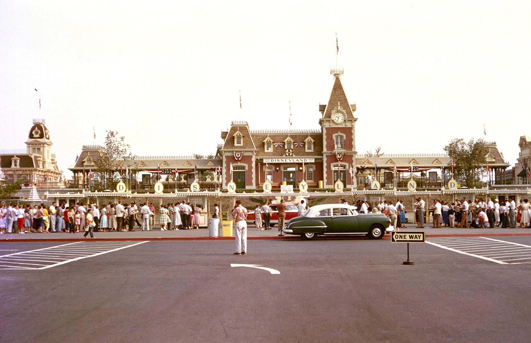 Slide 5 of 38: Such was the buzz around Disney's glittering new theme park that thousands more guests than the 6,000 invited turned up (reportedly some 28,000). This photo shows eager visitors queueing at Disneyland's main entrance on 17 July 1955. The huge influx of people meant the opening day didn't run quite as smoothly as planned, but luckily the public's fascination with this magical place was not marred.
