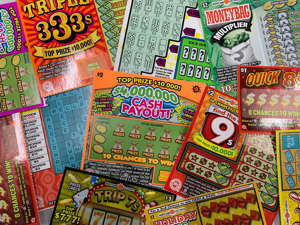 a stack of flyers on a table: Maryland lottery scratch off tickets bought from The Chicken Man Food Store located on Snow Hill Rd. In Salisbury, Md.