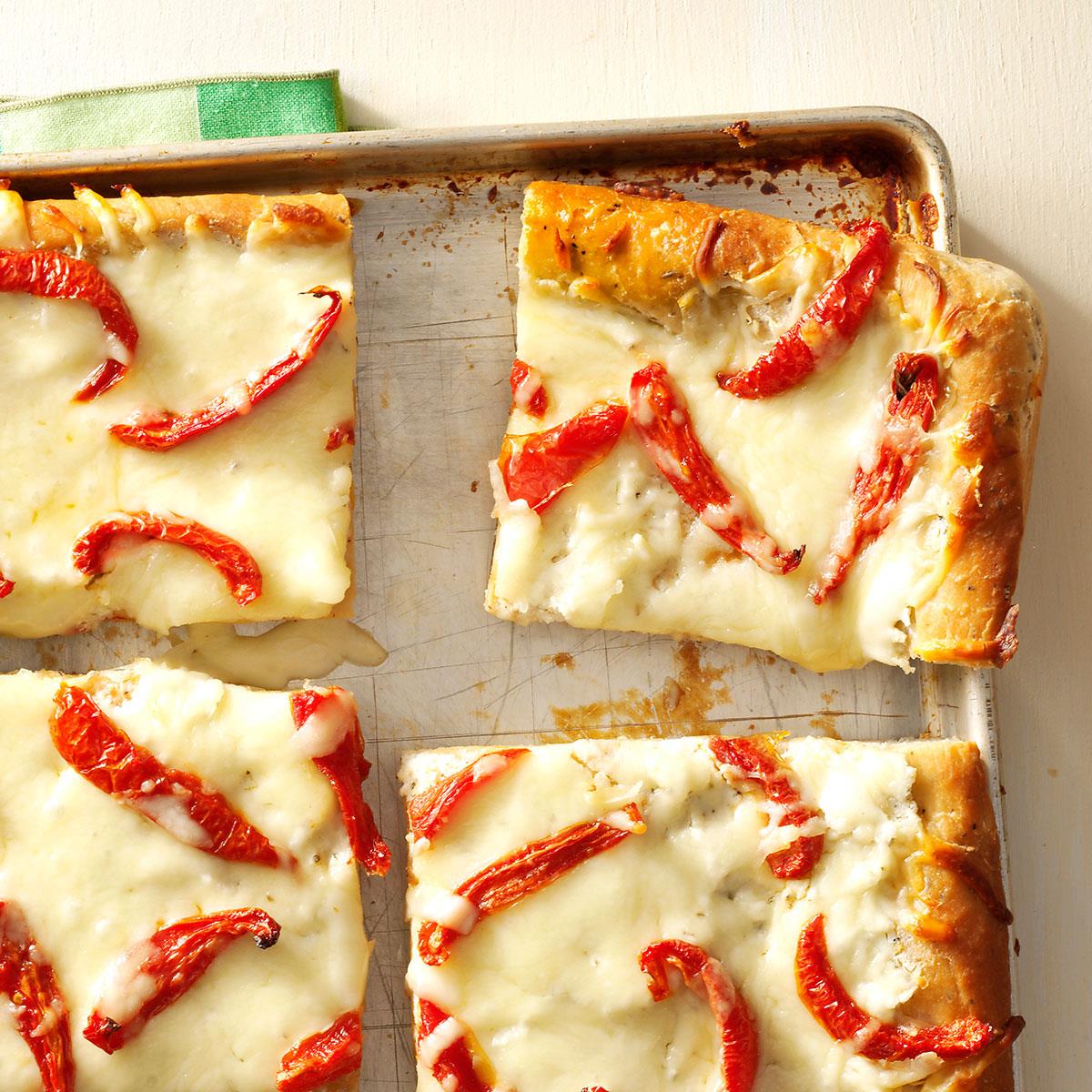 Like my grandmother taught me, I love using fresh, simple ingredients. In this low-cost recipe, creamy ricotta brings out the sweetness of the tomatoes, all on an onion and herb crust. —Debbie Roppolo, San Marcos, Texas <a href="https://www.tasteofhome.com/recipes/white-pizza-with-roasted-tomatoes/">Get Recipe</a>