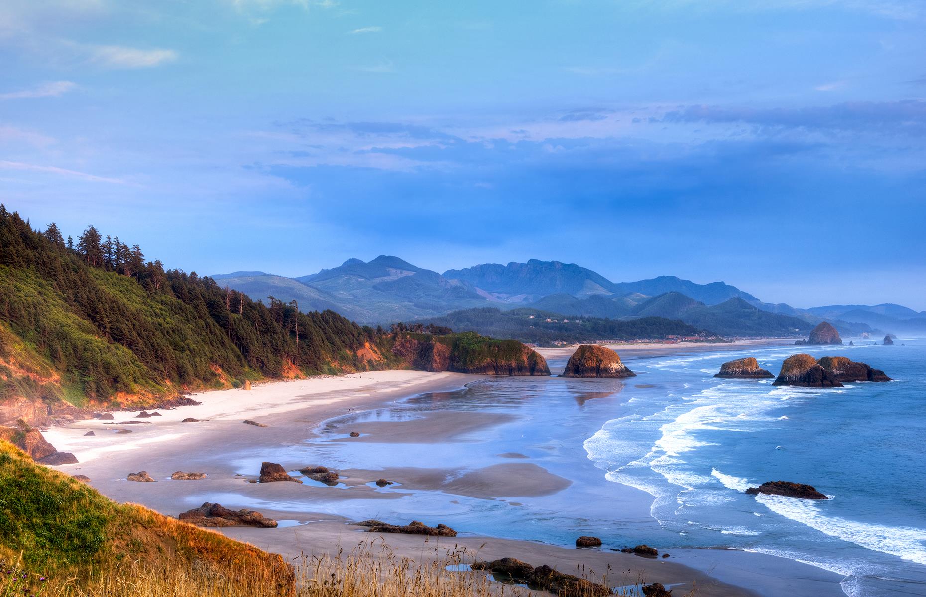 <p>This destination in northwest Oregon is a top weekend getaway for the locals living in the area and has a rich offering of microbreweries. But its breathtaking beach is the main attraction. The most recognizable landmark, the Haystack Rock, stands 235 feet (72m) above the sprawling sandy beach. A perfect spot for tide pooling, wildlife viewing and surfing, it's close to the Ecola State Park, too, making it the ultimate nature escape. Check <a href="https://stateparks.oregon.gov/index.cfm?do=park.profile&parkId=136">the park website</a> and <a href="https://traveloregon.com/travel-alerts/">Travel Oregon</a> for the latest alerts and advisories.</p>