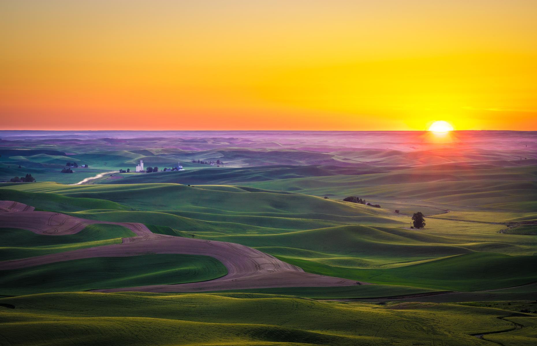 Slide 9 of 100: At first glance you might mistake these gently rolling hills and valleys for bucolic Tuscany in Italy – but they actually take up a swathe of southeastern Washington. Covered with flaxen wheat fields and peppered with neat farmhouses, trees and waterfalls, the Palouse is one of the most scenic agricultural regions in the United States. Discover more places you won't believe are in the USA here.