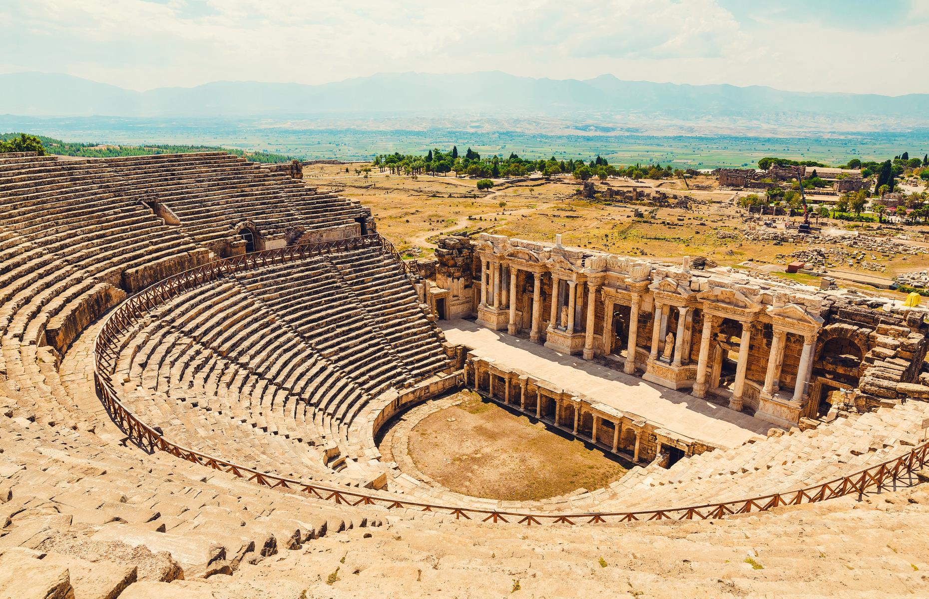 Slide 2 of 50: Hierapolis is an ancient Turkish city thought to date back to the 2nd century BC. The site sits close to the travertine pools of Pamukkale and it draws tourists with its atmospheric ruins, from crumbing baths to temple buildings. But there's one Greco-Roman temple in particular that has a peculiar story to tell. The temple is called Plutonium, named after Pluto, the God of the Underworld, and has long been dubbed the 'gate to hell'.