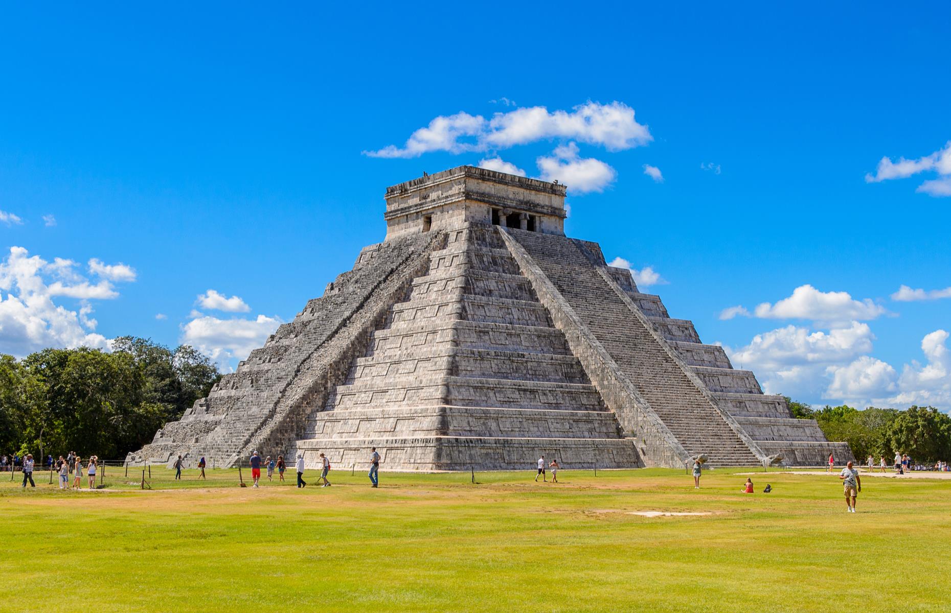 Slide 30 of 50: The ancient Maya city of Chichén Itzá, in Mexico's Yucatán Peninsula, is thought to date back to the 6th century. The site has many a treasure, from an intricate nunnery to a sacred cenote, but El Castillo is the most glittering jewel in Chichén Itzá's crown. The pyramid, whose name means 'The Castle', towers to 79 feet (24m). Its design, including 365 steps, one for each day of the year, is a nod to the Maya calendar. And today, it's still slowly relinquishing its secrets.