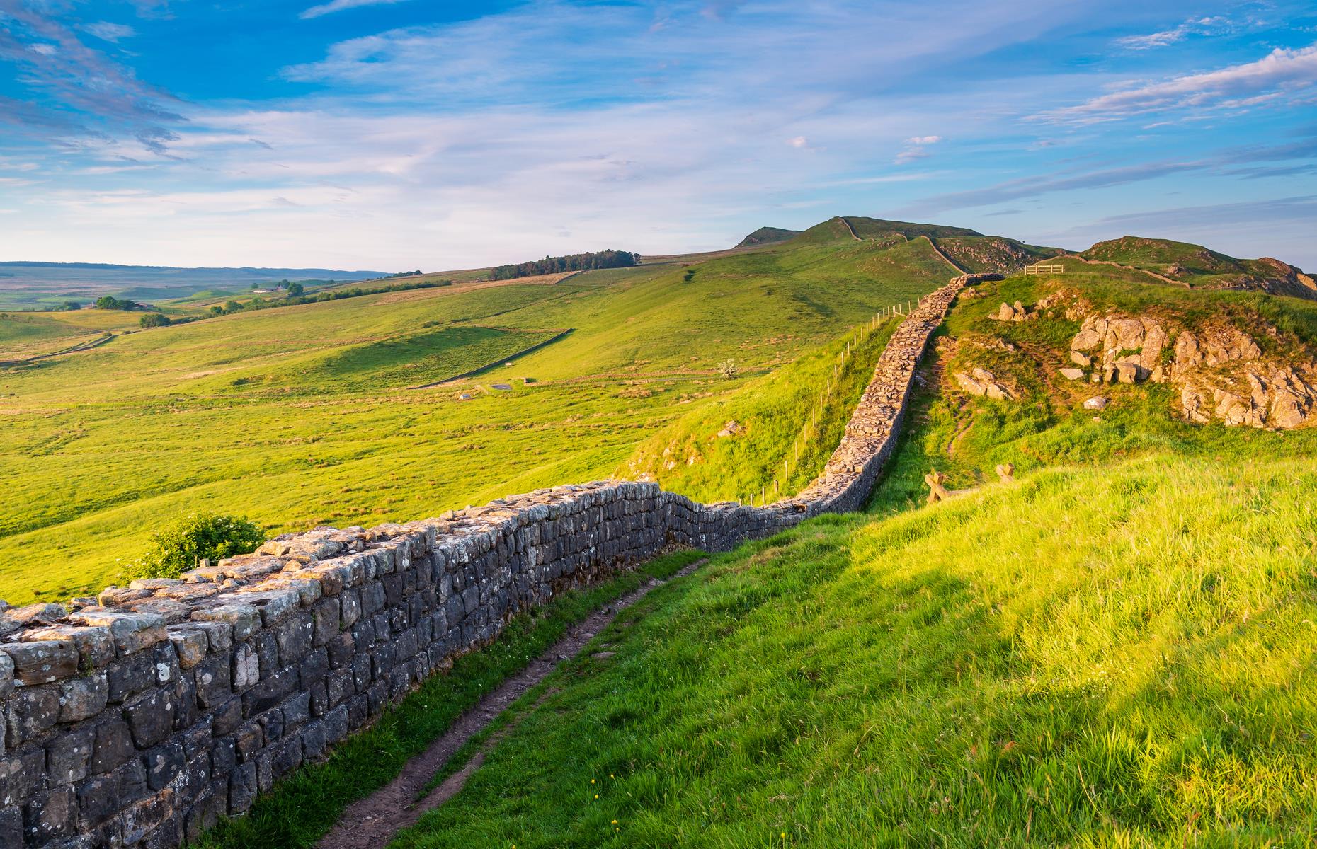 Slide 40 of 50: This mighty Roman wall extends for some 73 miles (118km), reaching from coast to coast in northern England, and dating back to around AD 120. It was the vision of its namesake, emperor Hadrian, who wanted to clearly delineate Roman territory. Today, many visitors follow all or part of the designated Hadrian's Wall Path. Continued excavations of the surrounding areas have also offered further glimpses into Roman history, and experts hit the jackpot with one dig in 2017.