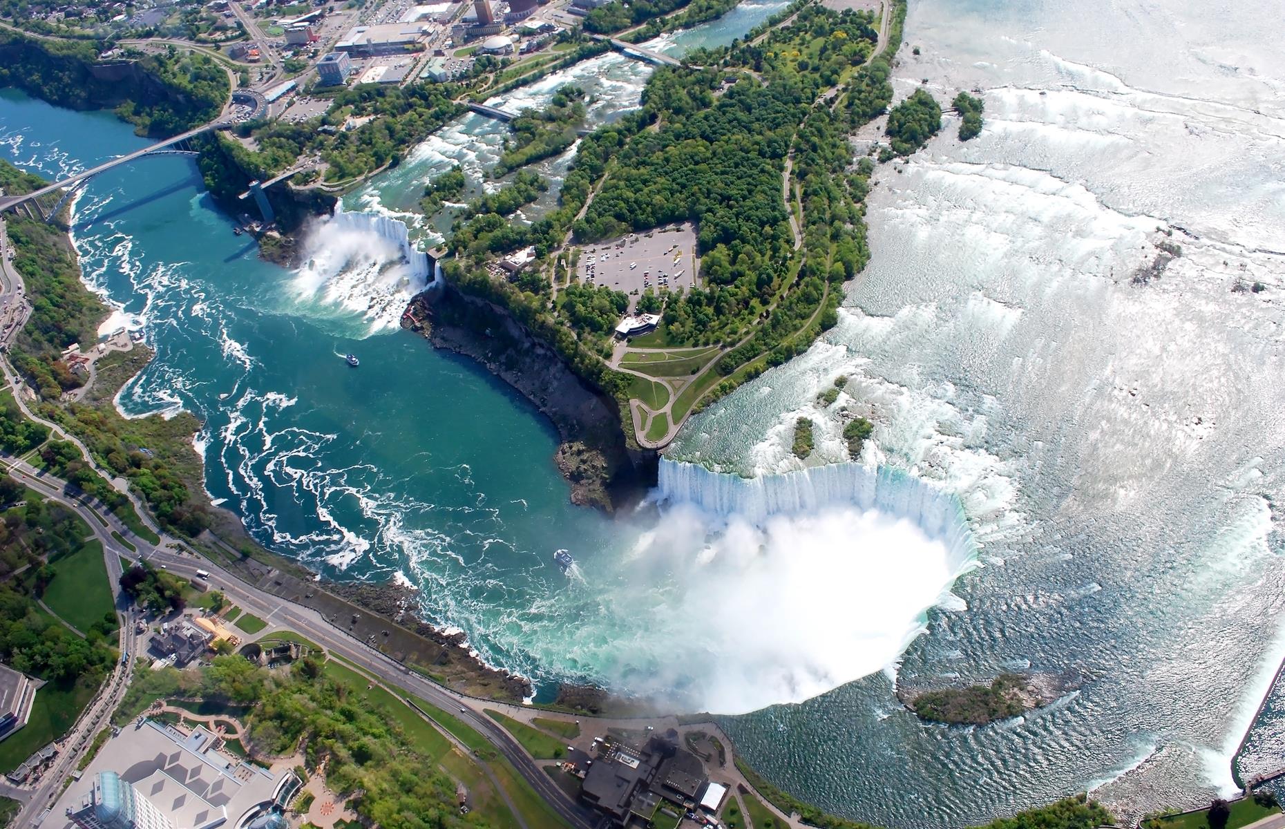 Slide 38 of 45: The most famous set of waterfalls in North America, Niagara Falls encompasses three cascades on the US-Canadian border: Bridal Veil Falls, American Falls and the mammoth Horseshoe Falls. The second-largest of the three, American Falls, is situated entirely within the US and crashes 180 feet (55m) into the river below. From above, the cluster of waterfalls looks especially spectacular.